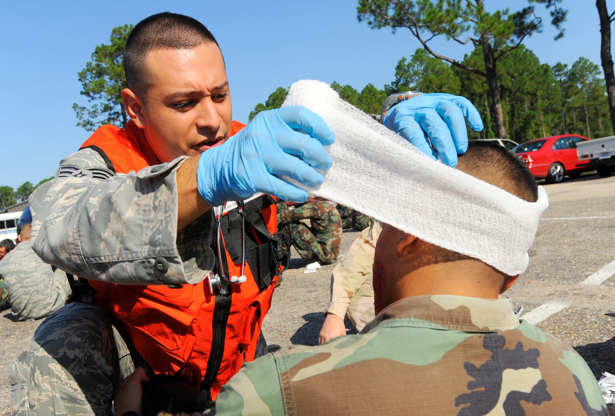 HURLBURT FIELD, Fla. ? An emergency medical technician wraps a bandage arounda victim?s head during a mass casualty exercise Jul 20. The exercise tested Hurlburt Field?s ability to respond to terrorist attacks. (U.S. Air Force photo/Senior Airman Jason Epley)
