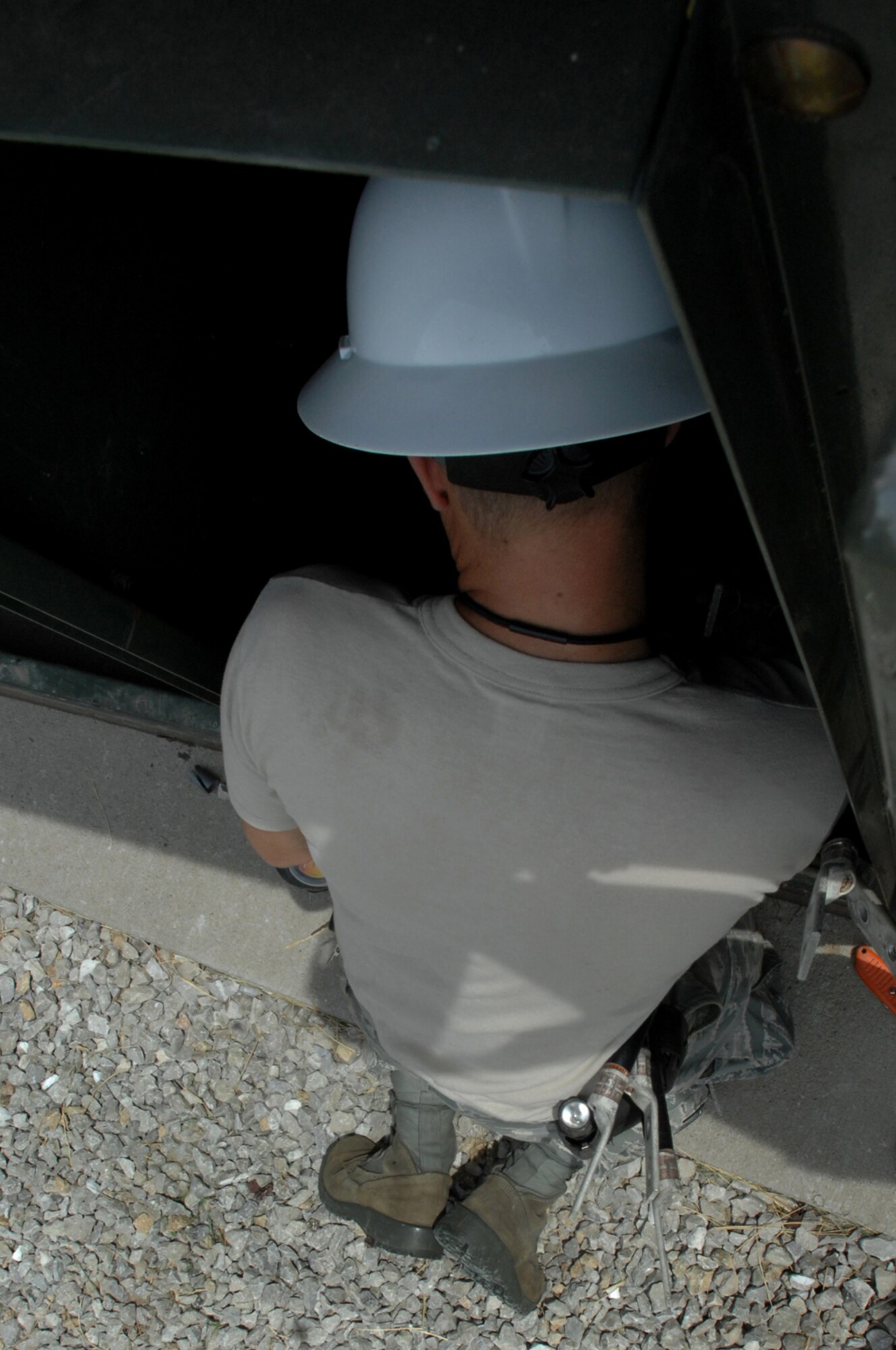 WHITEMAN AIR FORCE BASE, Mo. - Senior Airman Aaron Burgan, 509th Civil Engineer Squadron, works to replace a transformer after an un-replaceable fuse had blown, July 21. Both Airmen Burgan and Colantino were called late at night while on standby status and worked around the clock to ensure the transformer was properly replaced. (U.S. Air Force photo/Senior Airman Kenny Holston)