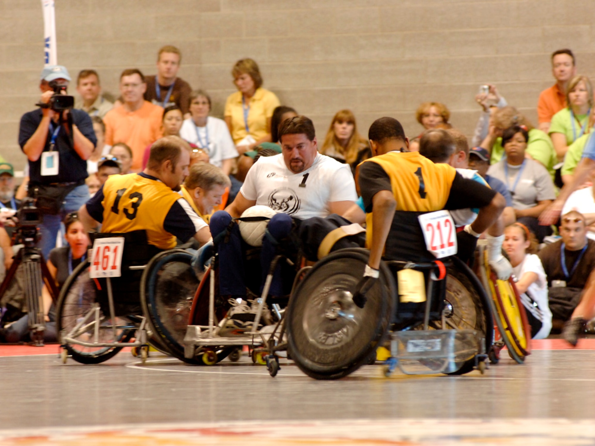 SPOKANE, Wash. – Scott Severn, a disabled Army veteran, struggles to pass the opposing team to score a goal during a quad rugby game at the 29th National Veterans Wheelchair Games at the Spokane Convention Center here July 14. (U.S. Air Force photo / Airman 1st Class Melissa L. Carlino)
