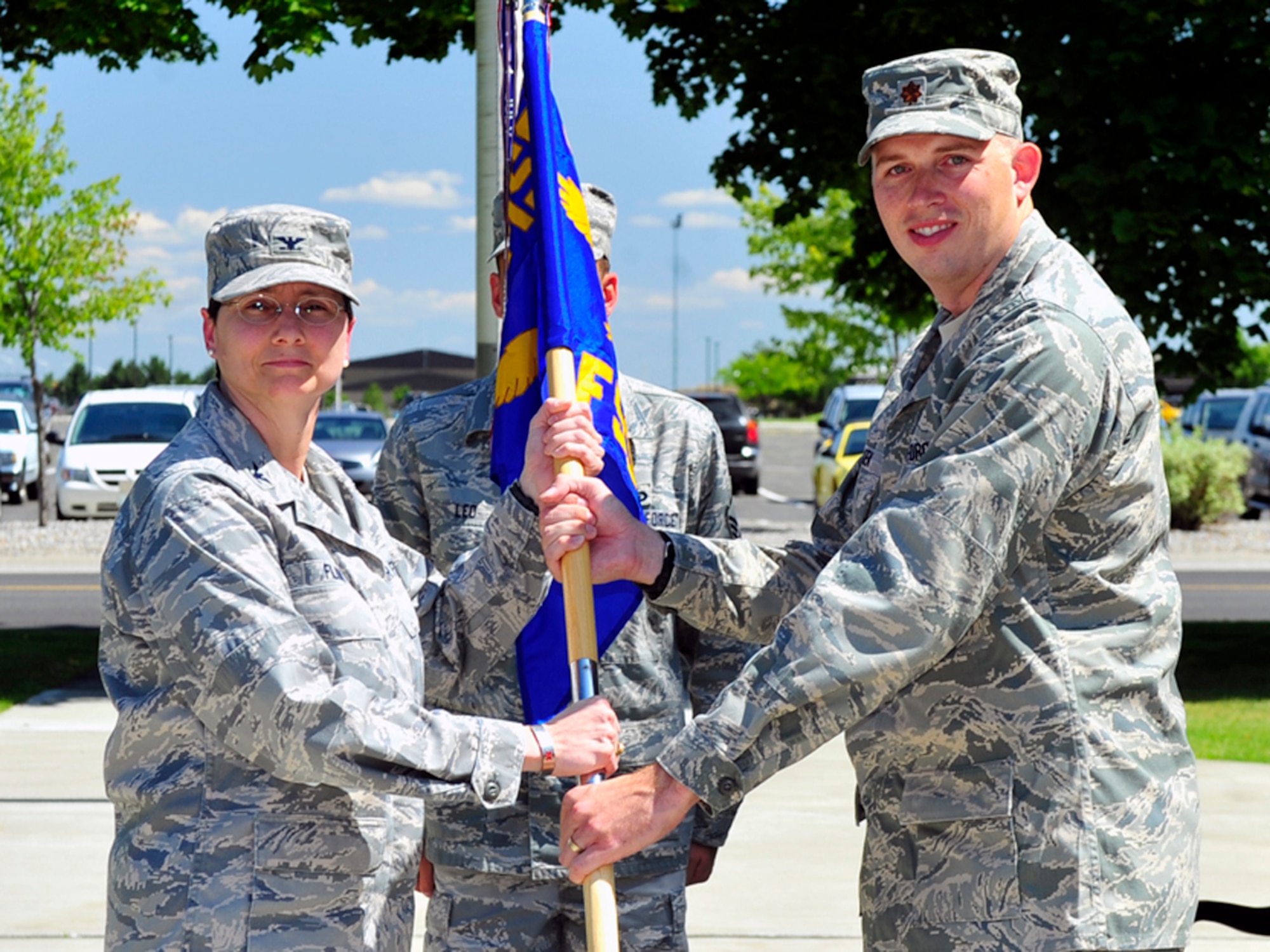 FAIRCHILD AIR FORCE BASE, Wash. – Maj. Brant Folken, accepts the ceremonial guideon from Col. Suzanne Filion, 92nd Mission Support Group Commander, during the 92nd Force Support Squadron Change of Command Ceremony here July 10. (U.S. Air Force photo / Airman 1st Class Melissa L. Carlino)
