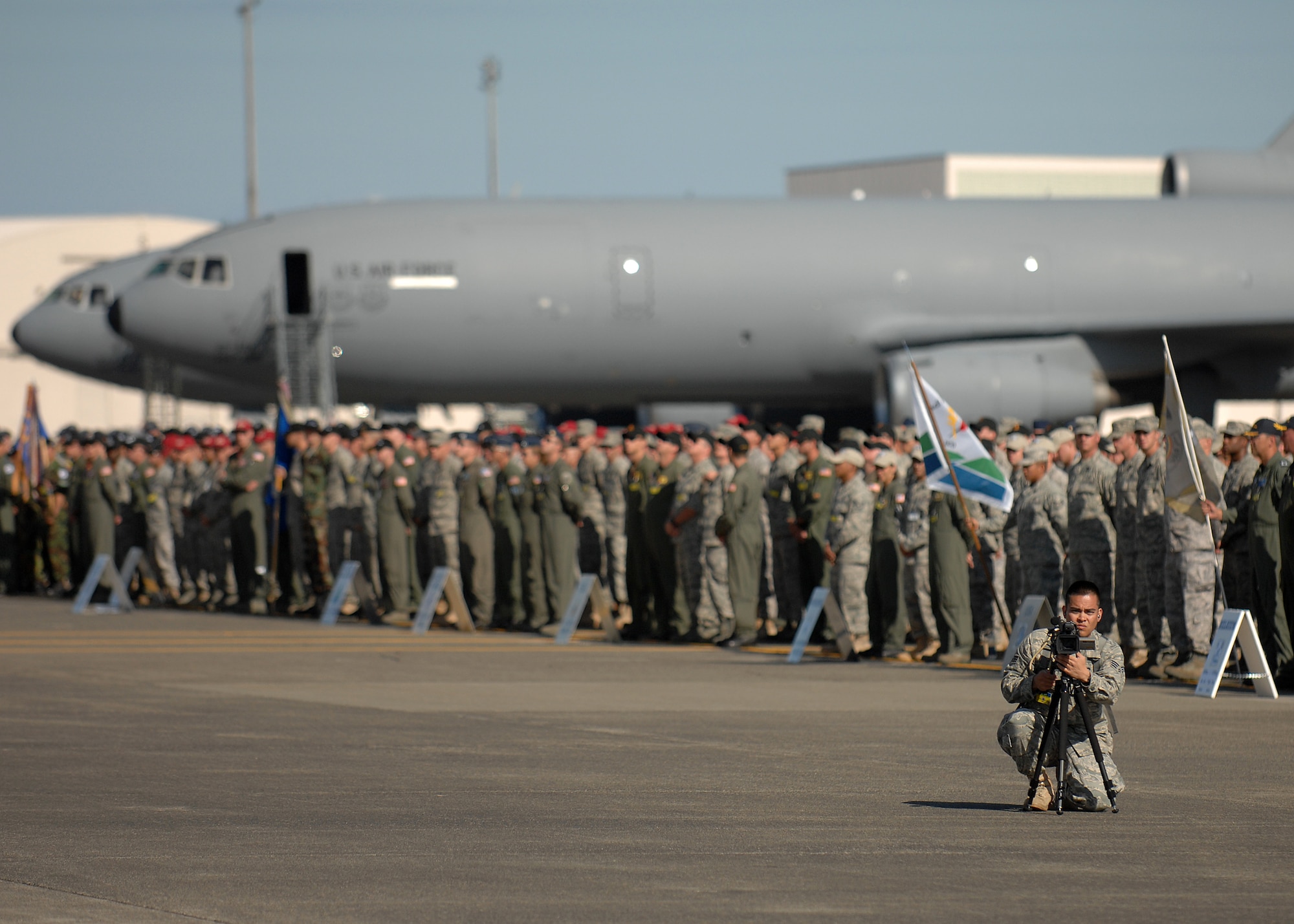 Senior Airman Jonathan Garcia documents the opening ceremonies of Air Mobility Rodeo's 2009 July 19 at McChord. (U.S. Air Force photo/Staff Sgt. Stephen Schester)
