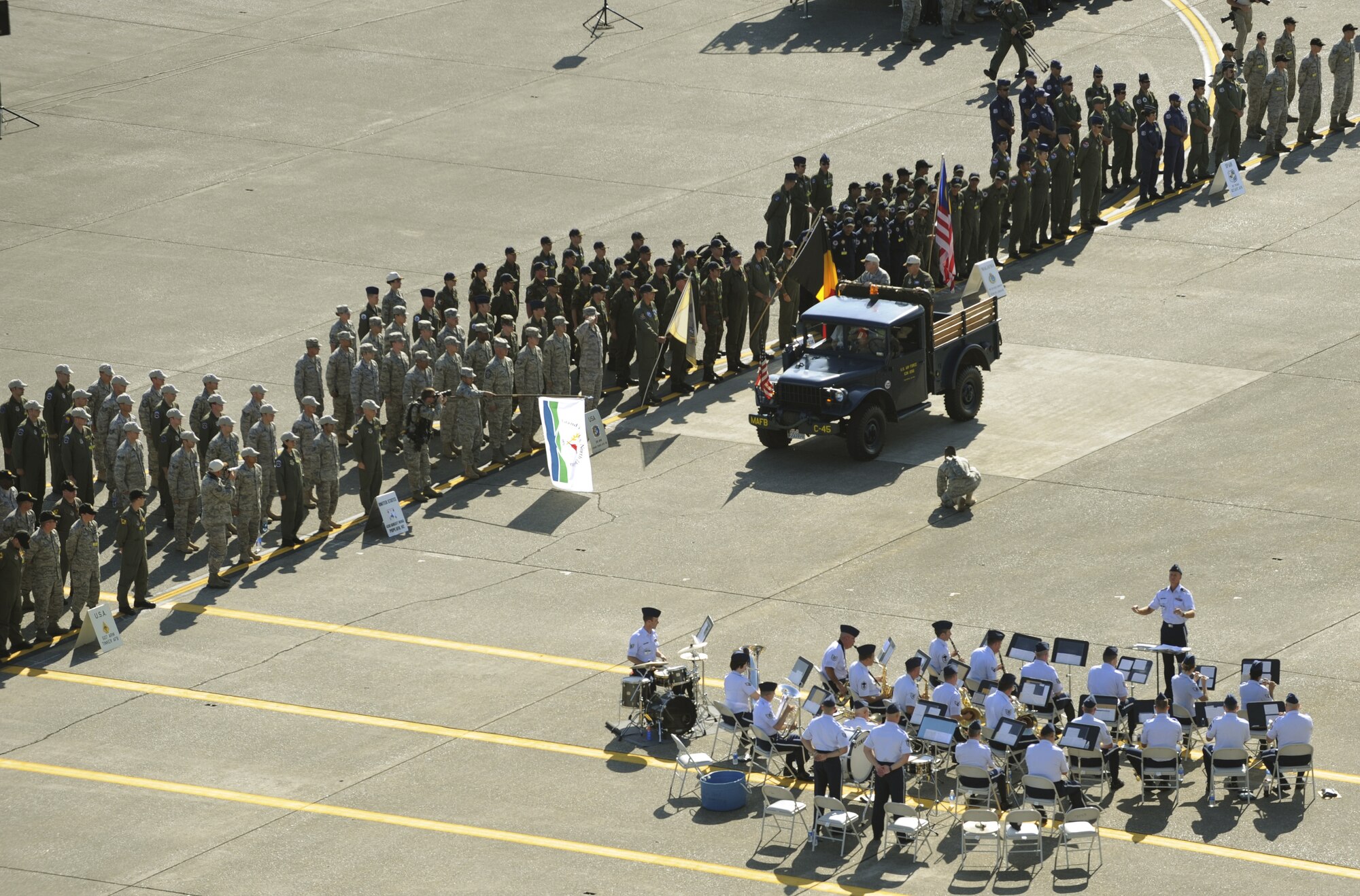 Gen. Arthur Lichte, Air Mobility Command commander and Maj. Gen. Brooks Bash, AMC director of operations and Rodeo leader, greet the participants of Rodeo 2009 during opening ceremonies July 19 at McChord. (U.S. Air Force photo/Tech Sgt. Michelle Larche)
