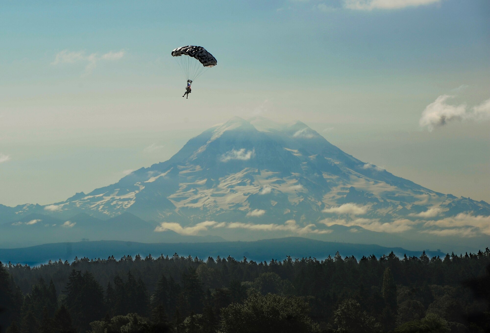 A high-altitude, low-opening parachute jumper prepares to land on the ground at the opening ceremonies for Rodeo 2009 at McChord July 19. (U.S. Air Force photo/Tech Sgt. Michelle Larche)