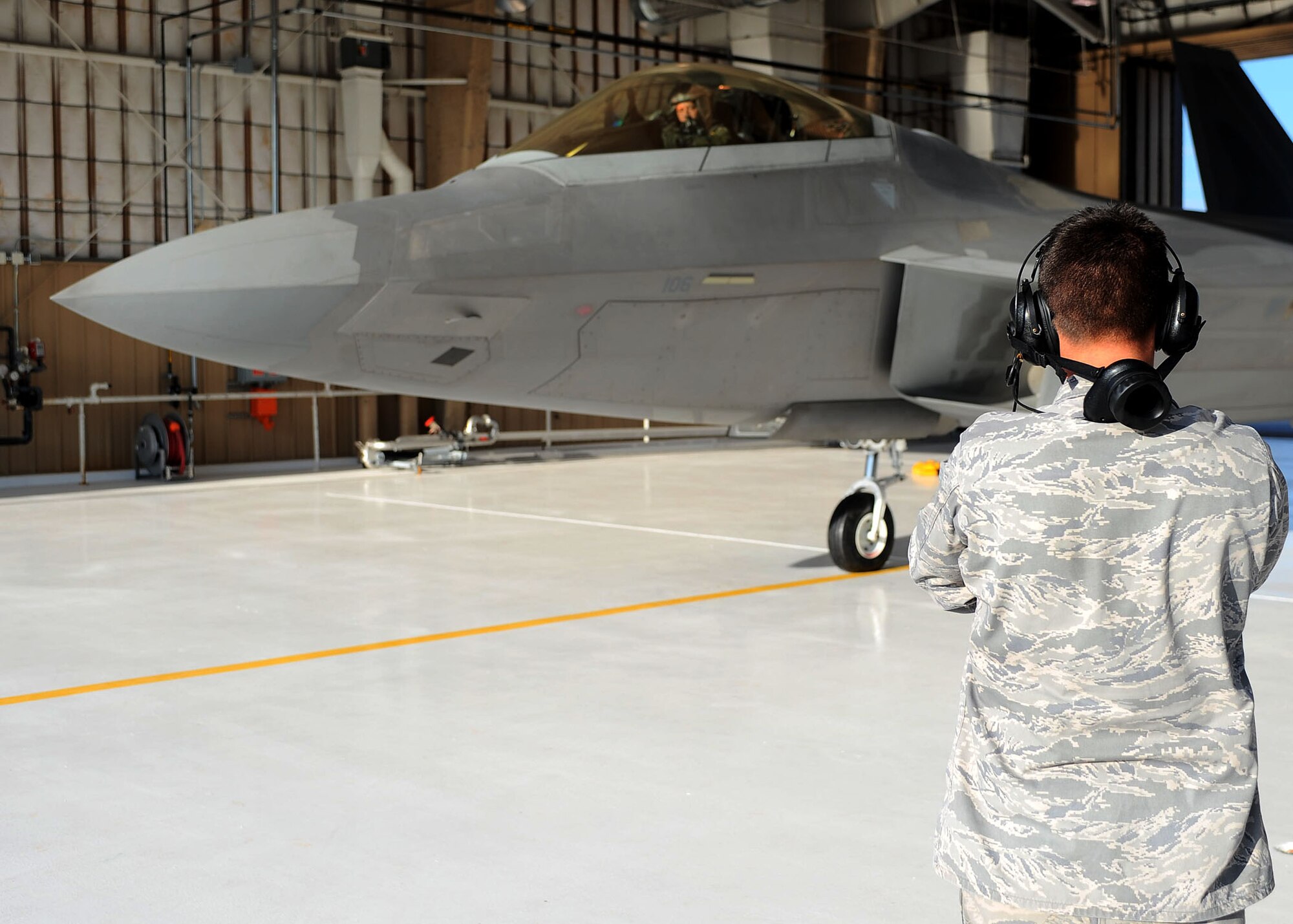 Senior Airman Bryan McMahon, 49th Aircraft Maintenance Unit, goes over some final preflight checks on an F-22A Raptor with Lt. Col. Mike Hernandez, 7th Fighter Squadron commander, at Holloman Air Force Base, N.M., July 18. The maintainers go through several checks to make sure the aircraft is fully operational. (U.S. Air Force photo/ Airman 1st Class DeAndre Curtiss)