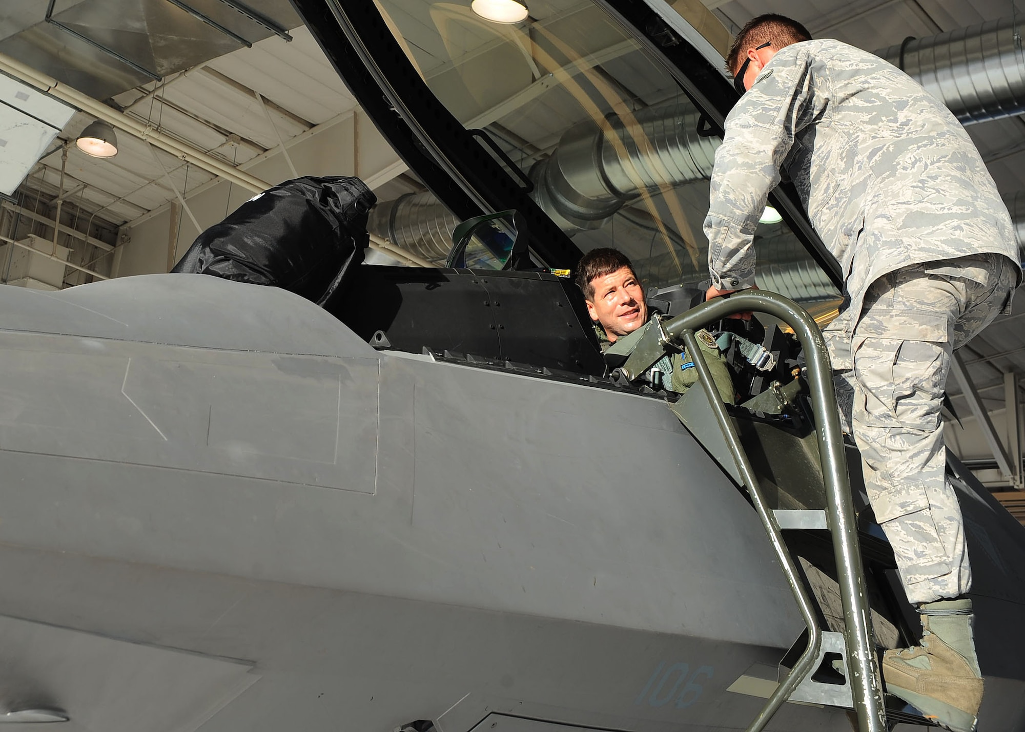 Senior Airman Bryan McMahon, 49th Aircraft Maintenance Unit, goes over some final preflight checks on an F-22A Raptor with Lt. Col. Mike Hernandez, 7th Fighter Squadron commander, at Holloman Air Force Base, N.M., July 18. The maintainers go through several checks to make sure the aircraft is fully operational. (U.S. Air Force photo/ Airman 1st Class DeAndre Curtiss)