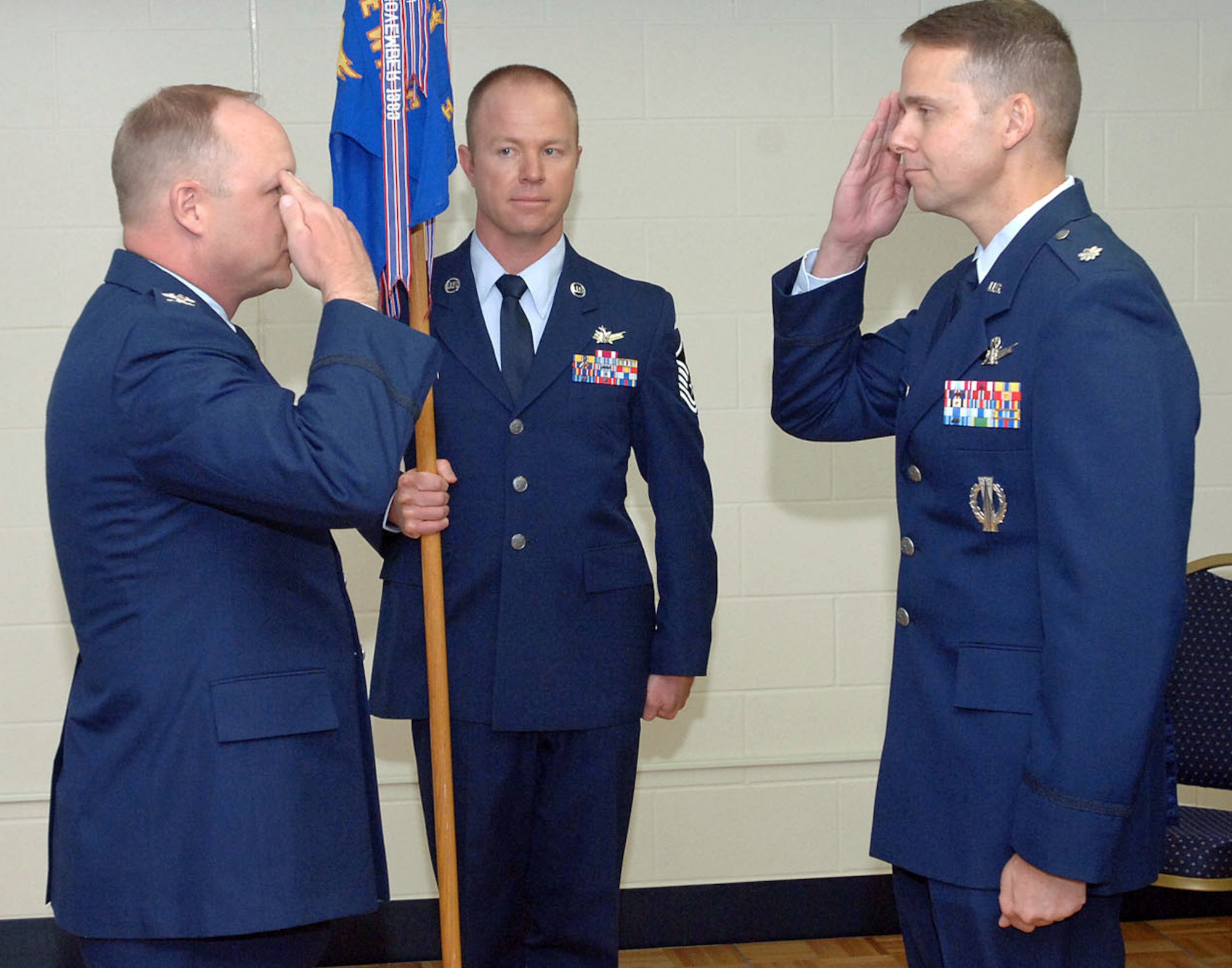 CAVALIER AIR FORCE STATION, N.D. -- The 10th Space Warning Squadron got its new commander June 10, as Lt. Col. John Thomas (right) took command June 10. Col. Chris Crawford (left), 21st Operations Group commander, presided. Cavalier AFS was recently recognized as the best space warning squadron in Air Force Space Command. Colonel Thomas comes to Cavalier AFS from Headquarters Air Force Space Command at Peterson AFB. (U.S. Air Force photo)
