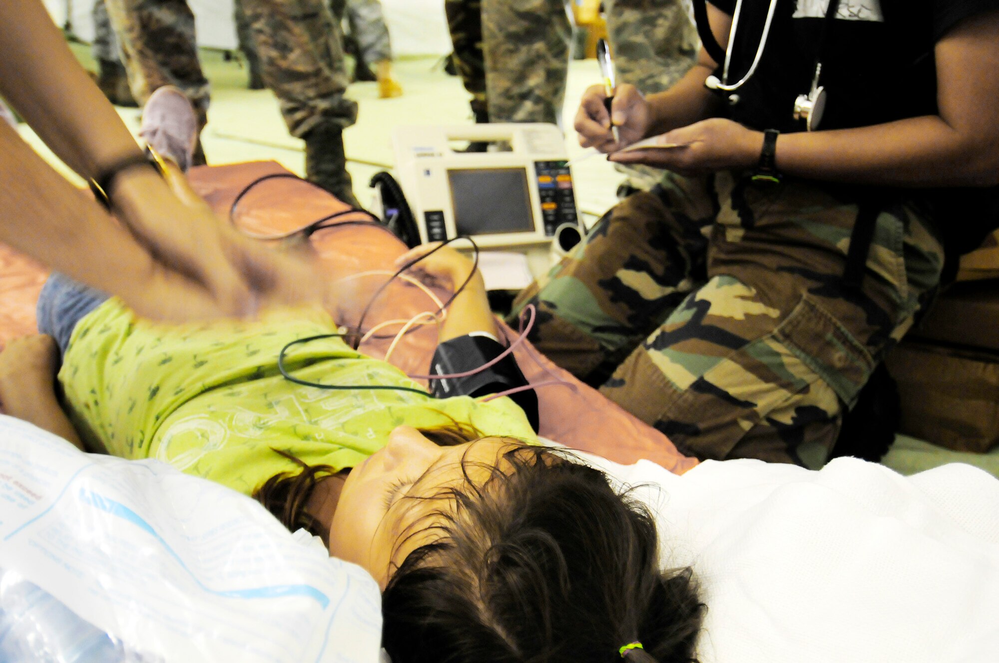 Mass casualty victim Alessia Castro is cared for by 36th Medical Group physicians during a simulated exercise for the Humanitarian Assistance Rapid Response Team July 15 at Andersen Air Force Base, Guam. (U.S. Air Force photo/Airman 1st Class Courtney Witt) 
