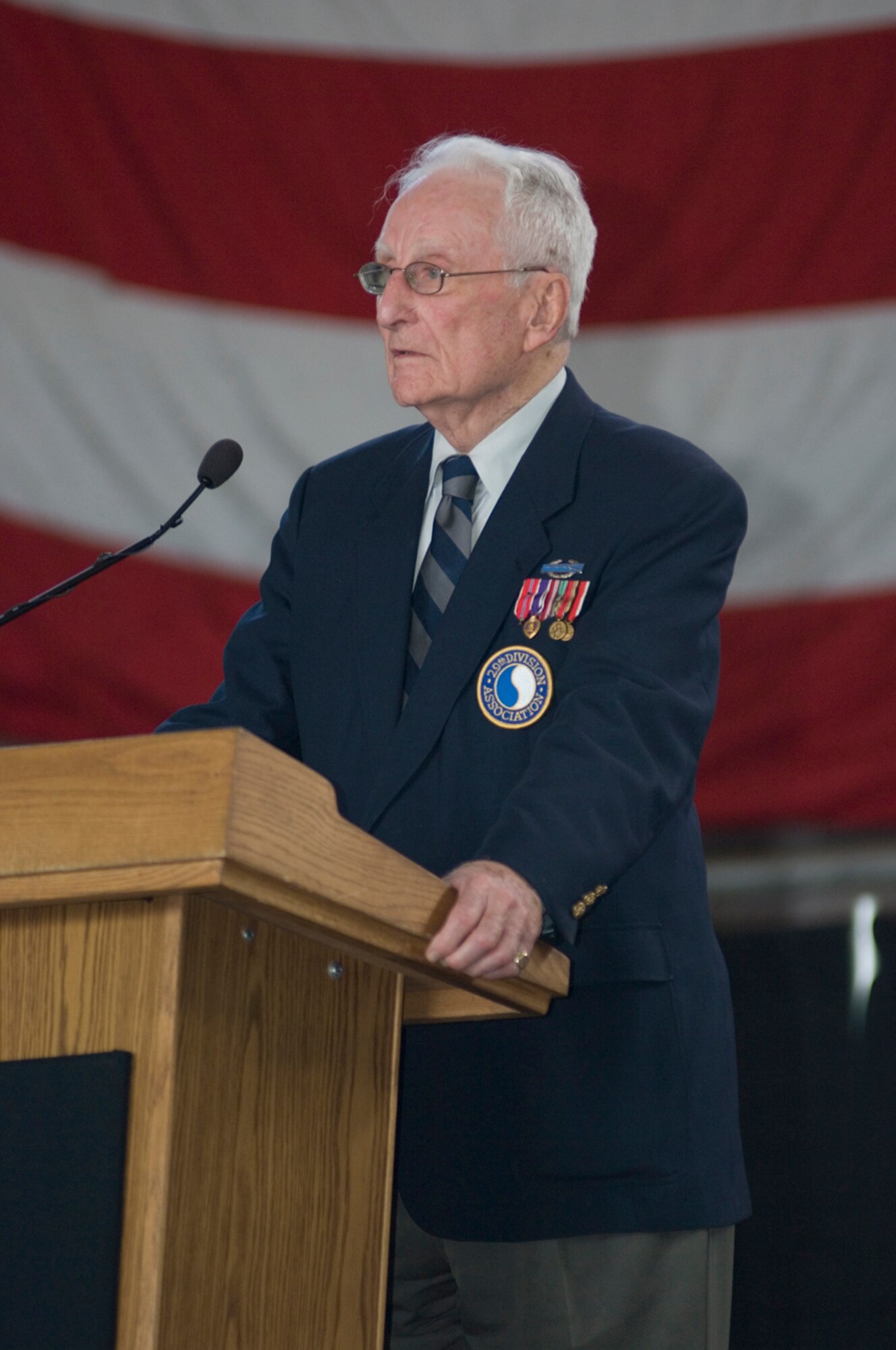 HANSCOM AIR FORCE BASE, Mass. –Morley Piper, a World War II veteran speaks during the Heritage of Freedom event on July 16, about his D-Day experiences as a 19 year old lieutenant in the 29th Infantry Division on June 6, 1944. Mr. Piper was a platoon leader in a rifle company assigned to the 115th Regiment where he led 30 men into battle on Omaha Beach and engaged the enemy through France and into Germany up until the end of World War II. The Heritage of Freedom event also included 1st Lt. Mike Sciortino of the 66th Medical Group who described how he earned the Bronze Star and Purple Heart working as a combat controller in Afghanistan. (U.S. Air Force photo by Mark Herlihy)