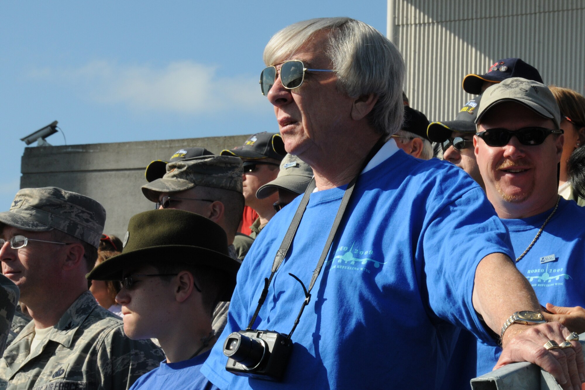 MCCHORD AIR FORCE BASE, Wash. -- Mr. JD Price and Mr. Chris Boyette watch the opening ceremonies at Air Mobility Command's Rodeo Competition. The two Goldsboro community leaders are distinguished guests of the 916th Air Refueling Wing during the week-long competition. (U.S. Air Force photo by: TSgt. Scotty Sweatt)