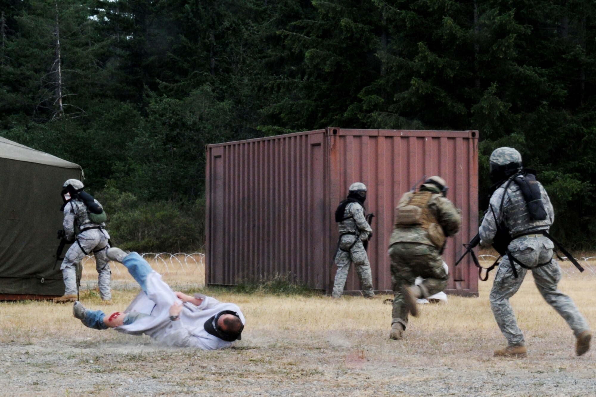 MCCHORD AIR FORCE BASE, Wash. -- 916th Air Refueling Wing Security Forces are engaged by insurgents during the Combat Tactics competition at Air Mobility Command's Rodeo 2009.  The scenario had security forces supporting the office of special investigations in a visit to a local village to make contact with an informant. (U.S. Air Force photo by: TSgt. Scotty Sweatt)