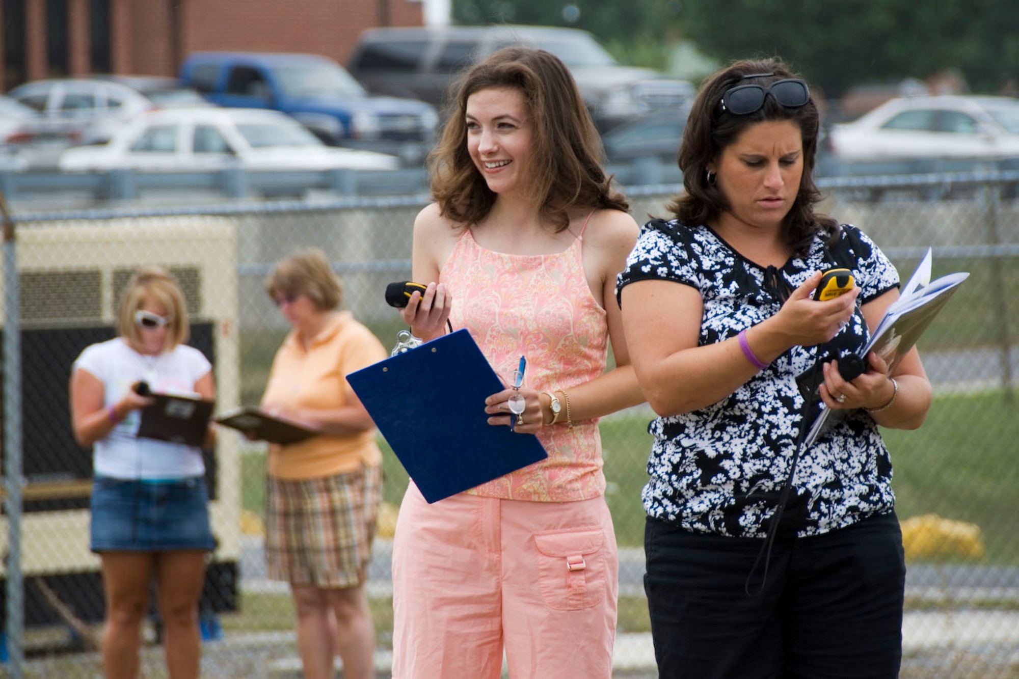 Berkeley County teachers Erin Sponaugle and Jennifer Higginbotham use GPS devices to track the coordinates of their location as part of an activity designed to measure the circumference of the earth, during a teachers workshop hosted by Martinsburg  STARBASE at the 167th Airlift Wing, Martinsburg West Virginia,  July 17, 2009. (U.S. Air Force photo by Master Sgt Emily Beightol-Deyerle)