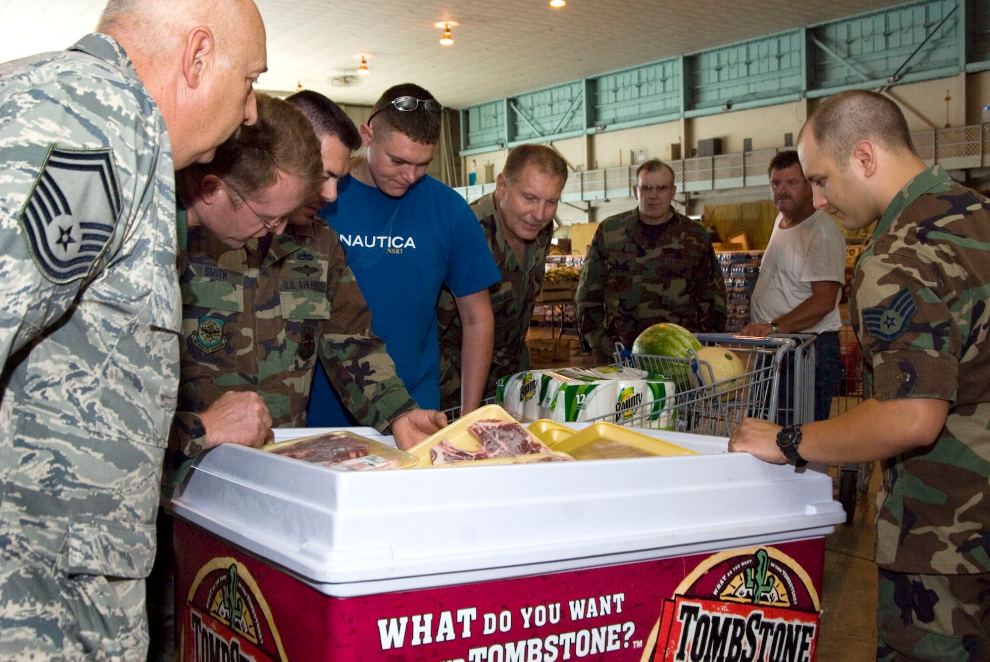 Members of the 167th Airlift Wing, West Virginia Air National Guard, gather around a freezer full of steaks on sale during the Andrews Air Force Base Commissary On-Site Sale held at the Martinsburg, W.Va. air base on Friday July 10, 2009 (U.S. Air Force photo by Master Sgt Emily Beightol-Deyerle)