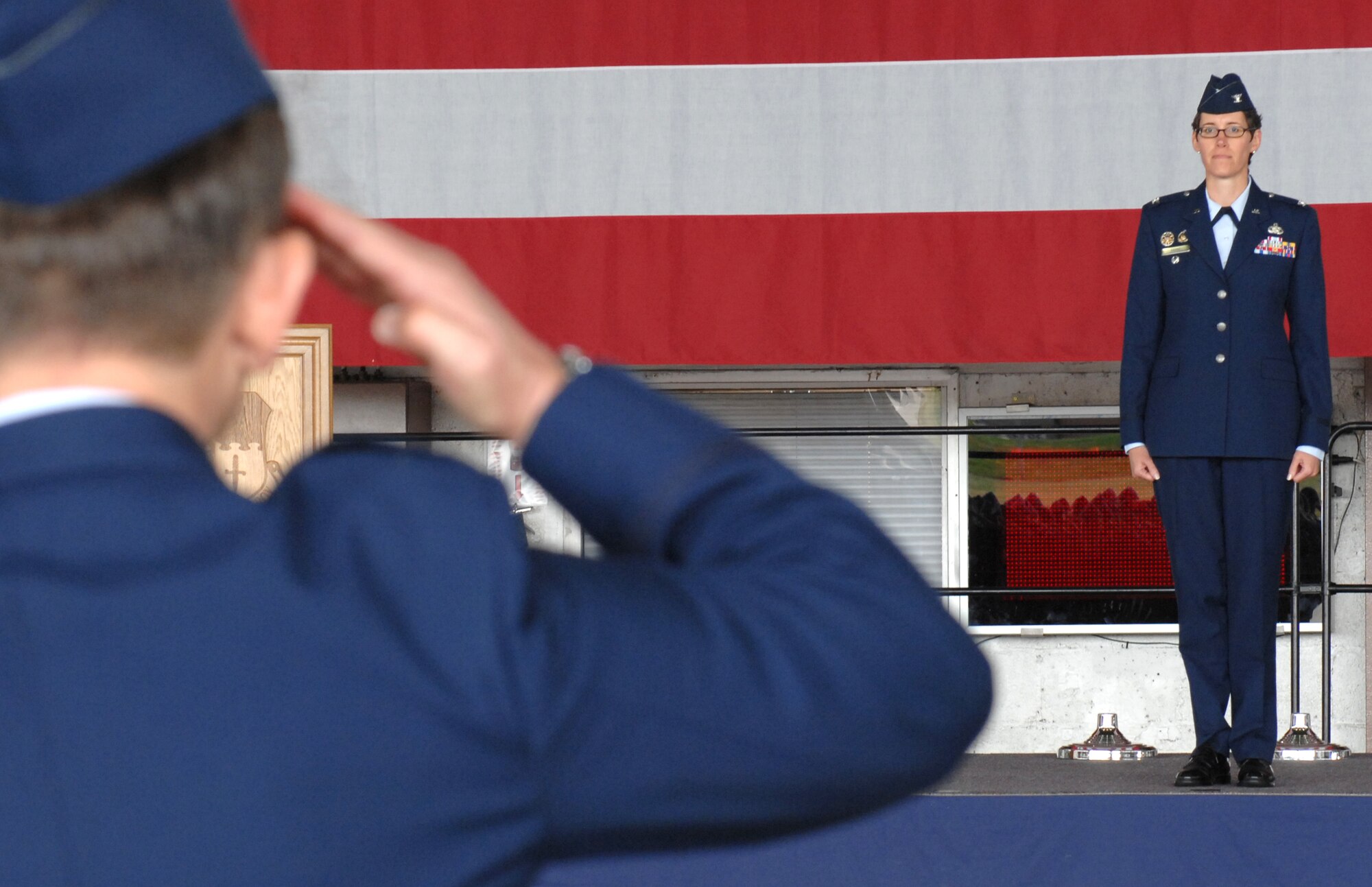 SPANGDAHLEM AIR BASE, Germany- Lt Col. Randall Thomsen renders the first salute on behalf of the Mission Support Group flights to incoming Mission Support Group commander Col. Jodine Tooke.  Colonel Tooke, formerly the Air Force Communications Agency vice commander at Scott Air Force Base, Ill., replaced outgoing Mission Support Group Commander Col. William Nadolski at the change-of-command ceremony on July 17 in Hangar 1. (U.S. Air Force photo by Master Sgt. Bill Gomez)