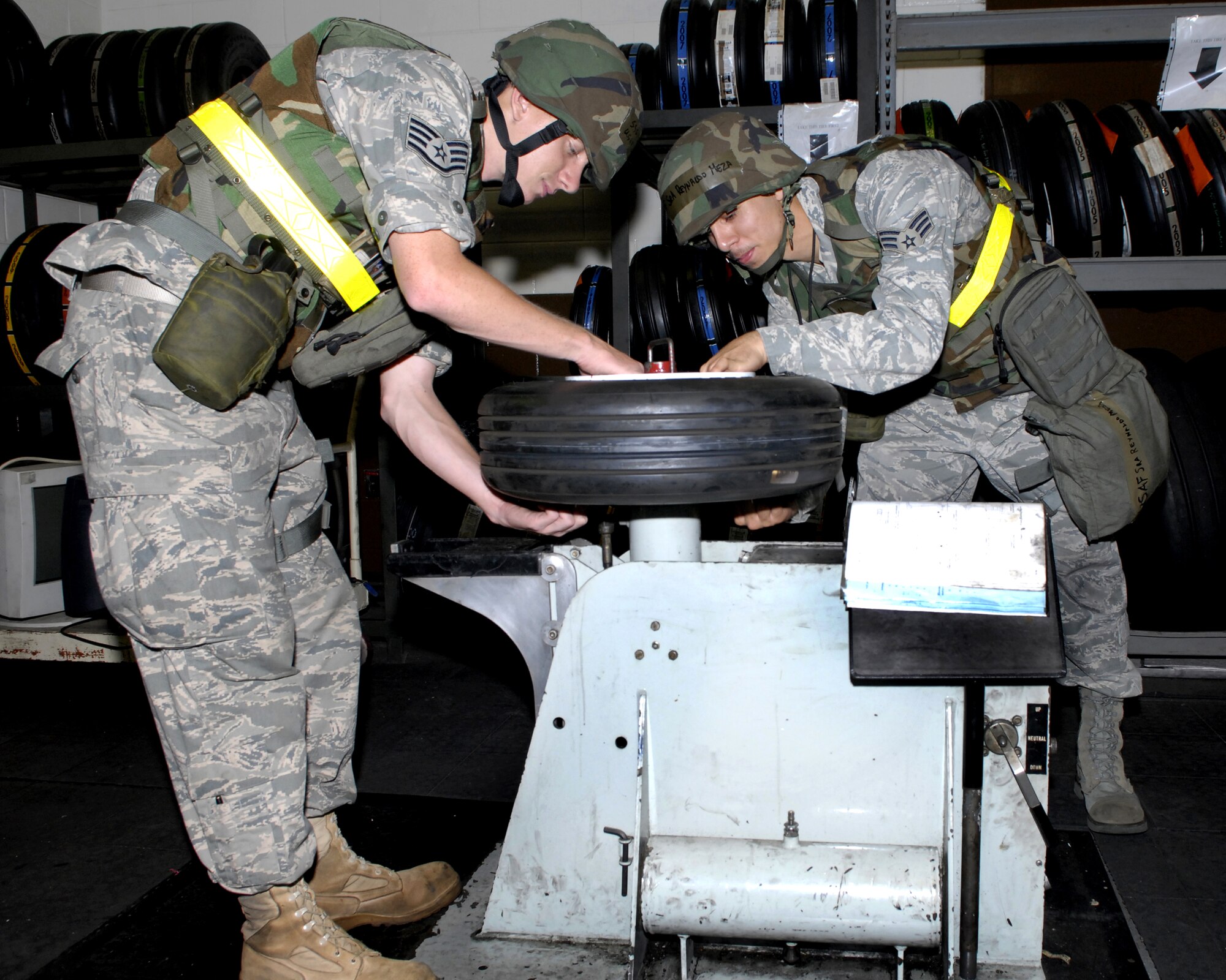 Staff Sgt. Joshua Johnson and Senior Airman Ray Meza build an A-10 nose tire assembly July 20 during Osan's Operational Readiness Exercise Beverly Bulldog 09-03.  Both are aero repairmen from the 51st Maintenance Squadron. (U.S. Air Force photo/Senior Airman Stephenie Wade)