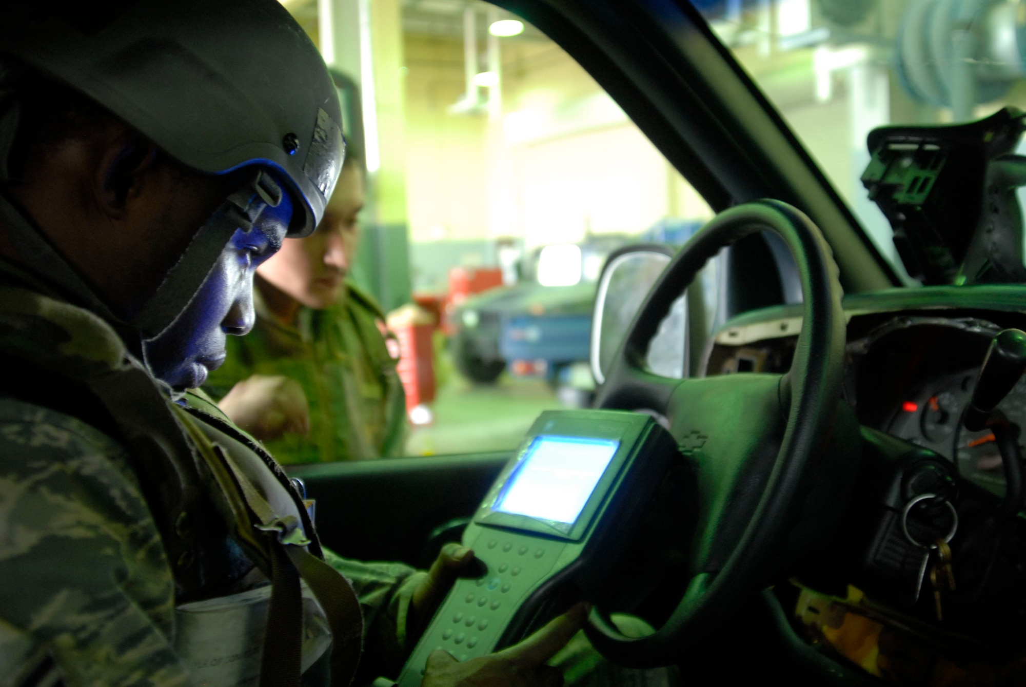 Senior Airman Jason Morris, who works vehicular equipment maintenance assigned to the 8th Logistics Readiness Squadron, uses a tech 2 diagnosis tool to scan all computerized equipment system in the G-van July 20 at Kunsan Air Base, Republic of Korea. Airman Morris is participating in a peninsula wide operational readiness exercise and is a native of Brooklyn, Ny. (U.S. Air Force photo/Staff Sgt. Darnell T. Cannady)