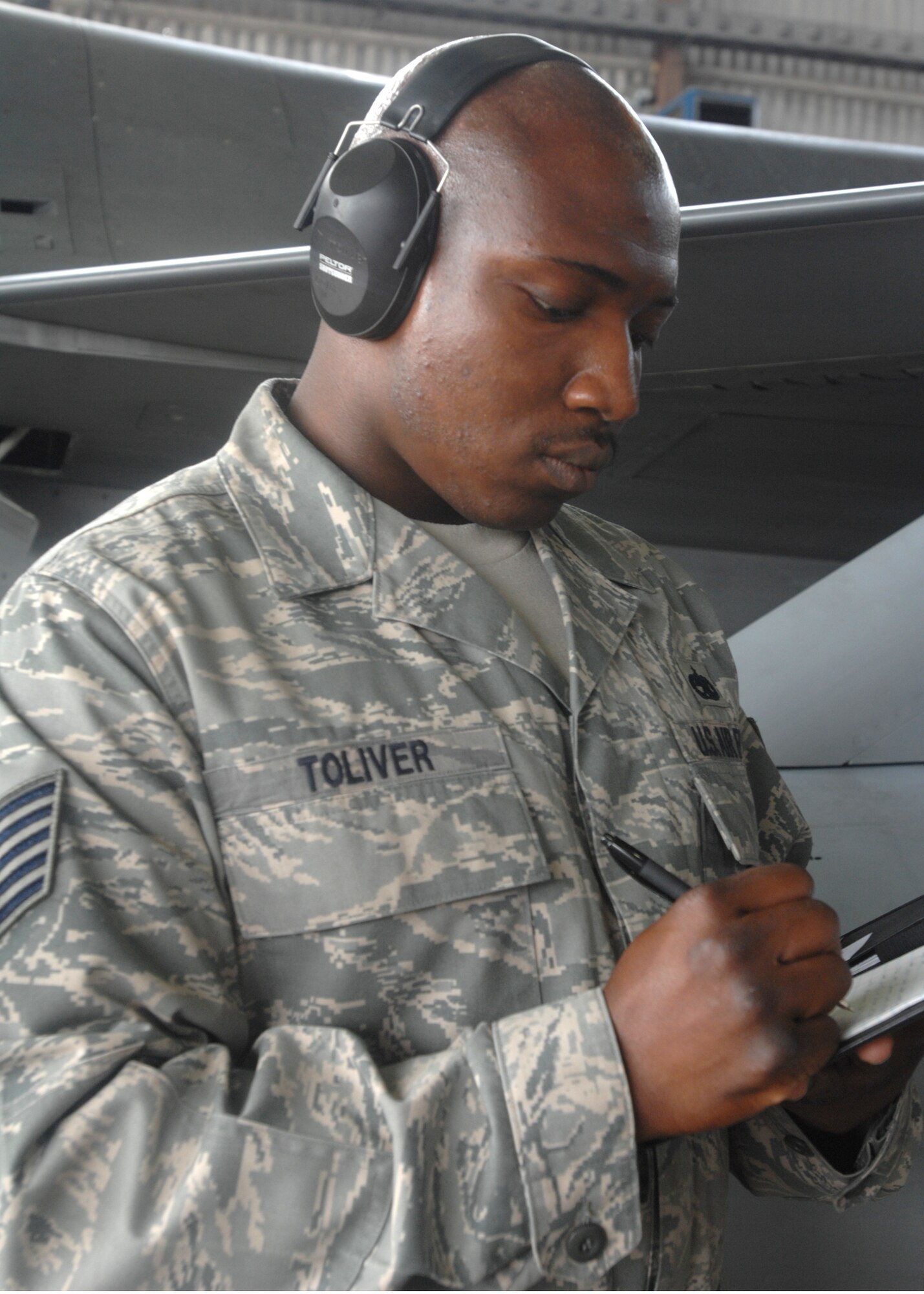 SPANGDAHLEM AIR BASE, Germany -- Tech. Sgt. Anthony Toliver, 52nd Aircraft Maintenance Squadron, takes notes while inspecting members of the 23rd Fighter Squadron during the load crew Ccompetition July 17. Members from the 23rd and 81st Fighter Squadrons put together three-man teams and competed against each other in loading weapons onto the F-16 Fighting Falcon and A-10 Thunderbolt II in the fastest time. (U.S. Air Force photo by Senior Airman Jenifer H. Calhoun)