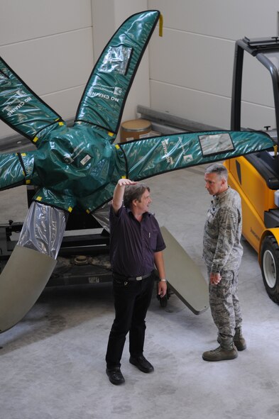 Ed Junko, 435th Logistics Readiness Squadron, material maintenance flight chief of operations, shows U.S. Air Force Col. Thomas Gould, 435th Air Base Wing commander, around the new C-130J Hercules parts store, Ramstein Air Base, Germany, July 14, 2009.  The parts store offers better support for aircrew and maintainers at Ramstein while saving cost and manpower. (U.S. Air Force photo by Airman 1st Class Caleb Pierce) 