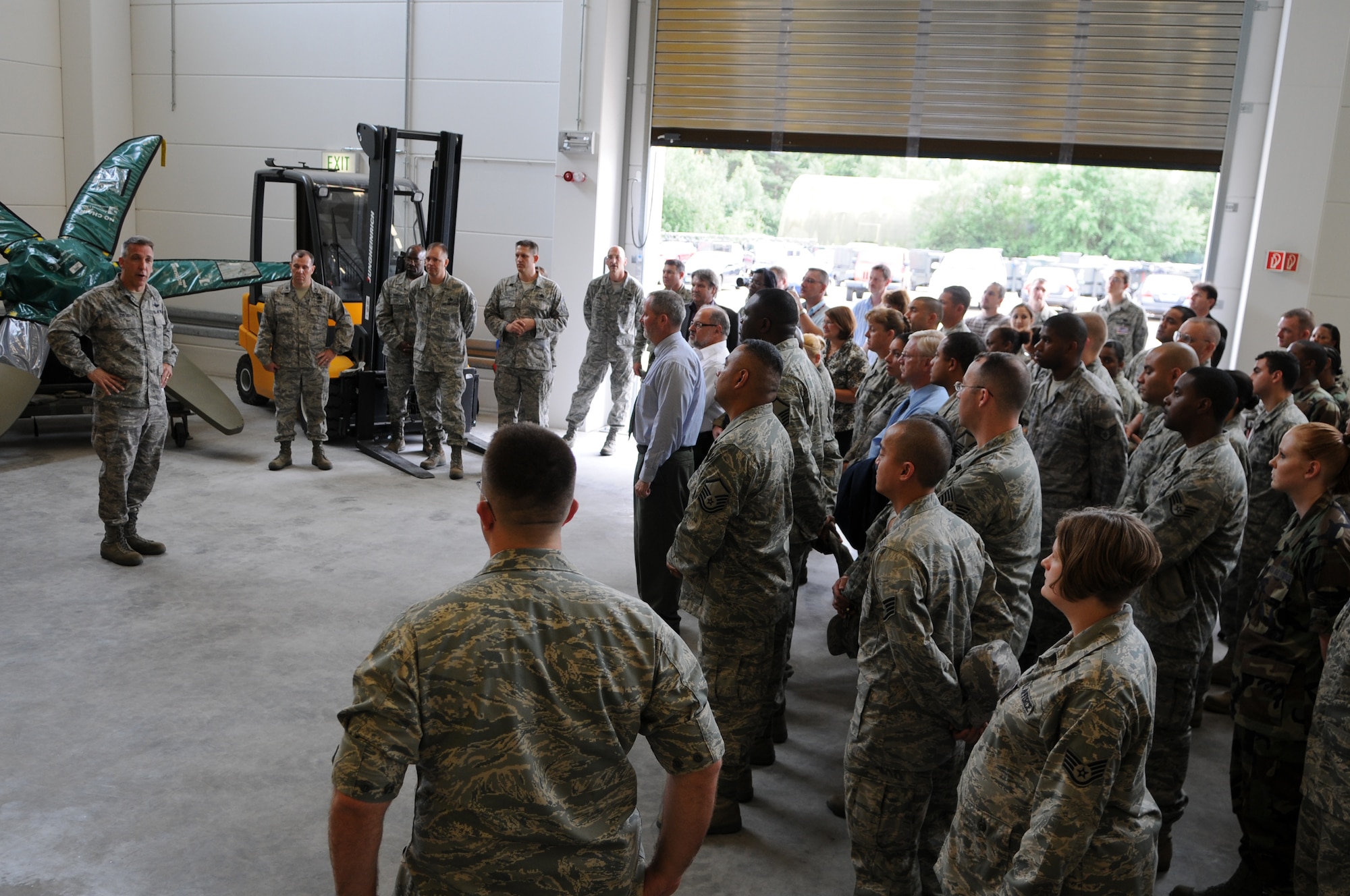 U.S. Air Force Col. Thomas Gould, 435th Air Base Wing commander, speaks at the ribbon cutting and opening ceremony of the new C-130J Hercules parts store, Ramstein Air Base, Germany, July 14, 2009.  The parts store has capacity for more than 6,000 line items for the C-130 J and up to six propellers. (U.S. Air Force photo by Airman 1st Class Caleb Pierce)