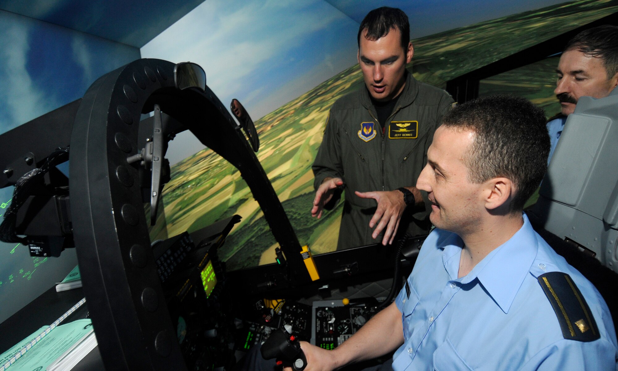 SPANGDAHLEM AIR BASE, Germany – Capt. Jeffery Dennis, 81st Fighter Squadron, explains the proper technique for executing air-to-air tactics to Maj. Darko Glisic, A-2 desk officer for the Serbian Air Force and Air Defense Command, as Col. Zlatko Sobot, chief of Serbian Air Force and Air Defense Operation Center, observes during their visit to Spangdahlem Air Base July 16. Four members of the Serbian air force came to Spangdahlem to learn how a fighter squadron runs as part of their visit to the 603rd Air and Space Operations Center located at Ramstein Air Base, Germany.. (U.S. Air Force photo/Senior Airman Benjamin Wilson)