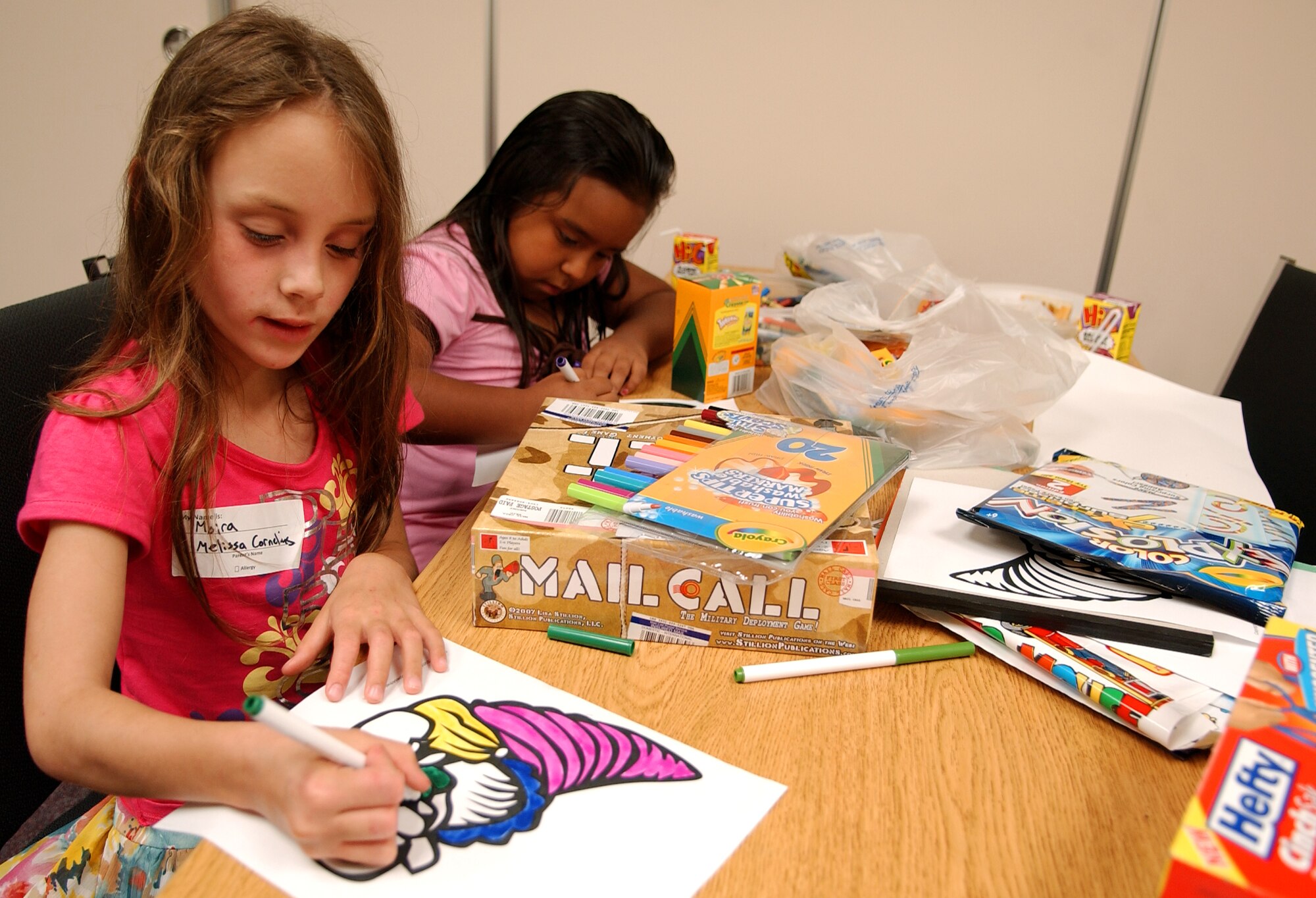 Children have an evening of fun with members of Airmen Committed to Excellence at the Schilling Community Center during the Deployed Spouses Dinner July 18.
(U.S. Air Force photo/Tech. Sgt. Rey Ramon)    