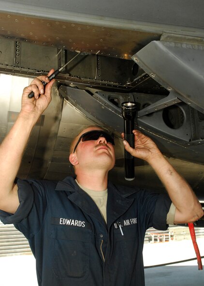 BAGRAM AIRFIELD, Afghanistan - Staff Sgt. Christopher Edwards, a crew chief from the 336th Aircraft Maintenance Squadron, replaces the hydraulic horizontal stabilizer actuator on an F-15E July 20. Sergeant Edwards is deployed from Seymour Johnson Air Force Base, N.C., and hails from Estherville, Iowa. The F-15E Strike Eagle is a dual-role fighter designed to perform air-to-air and air-to-ground missions. The Strike Eagles launch in support of coalition forces around the clock. (U.S. Air Force photo/Senior Airman Felicia Juenke)