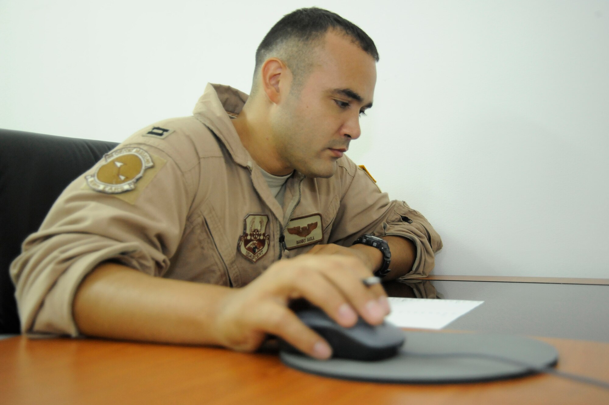 SOUTHWEST ASIA - Capt. Danny Avila, 908th Expeditionary Refueling Squadron, takes an Air Command and Staff College test to complete the correspondence course at the education office July 20th. Captain Avila is deployed from McGuire AFB, N.J., and hails from Sumter, S.C. (Air Force photo/Senior Airman Stephen Linch)