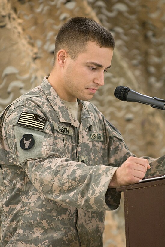 U.S. Army Spc. Jacob Benson delivers the memorial at a July 20, 2009, service honoring three fallen comrades who were killed in action as the result of a rocket attack on Contingency Operating Base Basra, Iraq, July 16, 2009. Benson, a military policeman assigned to the 34th Infantry Division's 34th Military Police Company, Special Troops Battalion, was wounded in the attack that killed his comrades.