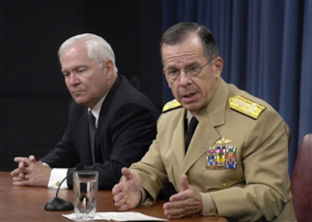 Chairman of the Joint Chiefs of Staff Adm. Mike Mullen, U.S. Navy, explains to reporters the extraordinary restraint shown by American combat forces in Afghanistan in order to prevent civilian casualties during a joint press briefing in the Pentagon with Secretary of Defense Robert M. Gates (left) on July 20, 2009.  