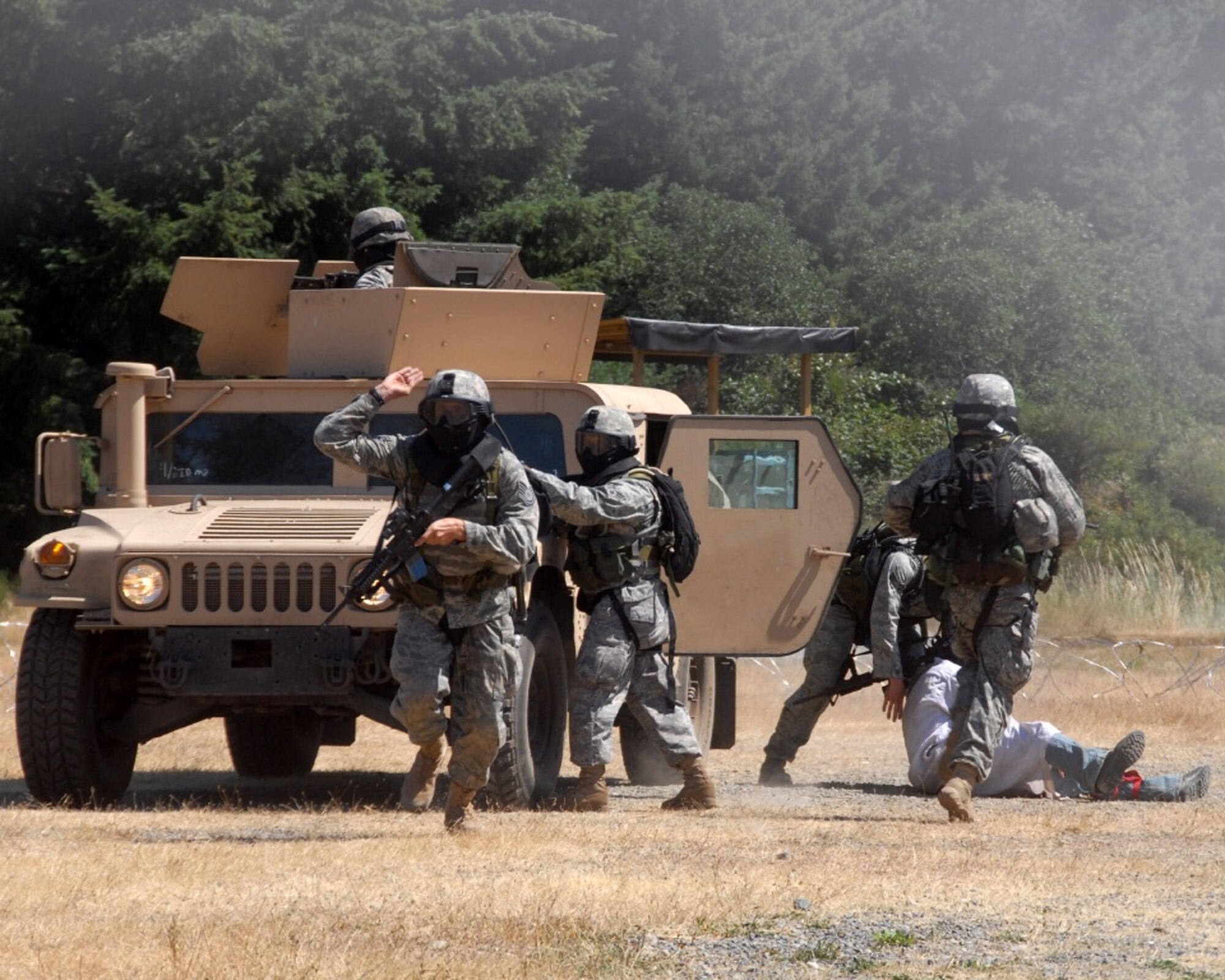 Security forces Airmen from the Ohio Air National Guard's 121st Security Forces Squadron at Columbus participate in competition July 21, 2009, for Air Mobility Rodeo 2009 at McChord Air Force Base, Wash.  During RODEO, security forces Airmen are tested in numerous ground combat scenarios.  (U.S. Air Force Photo/Capt. Karen O'Neill)