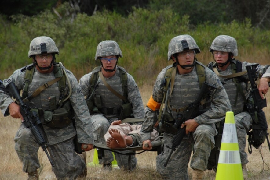 Airmen from the Ohio Air National Guard's 121st Security Forces Squadron at Columbus participate in security forces competition July 21, 2009, for Air Mobility Rodeo 2009 at McChord Air Force Base, Wash.  During RODEO, security forces Airmen are tested in numerous ground combat scenarios during the competition.  (U.S. Air Force Photo/Capt. Karen O'Neill)