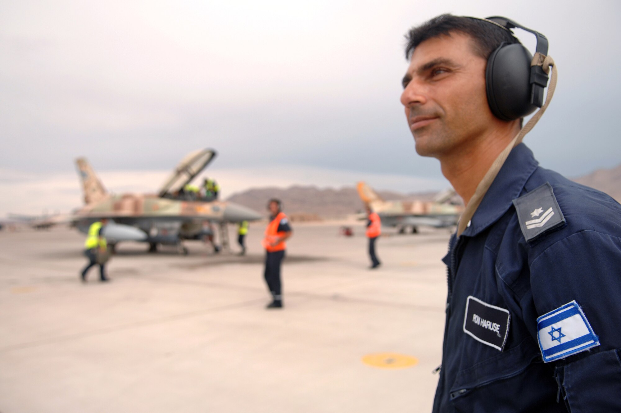 Roni, An Israeli Air Force Crew Chief watches over F-16CGs before launch from Nellis Air Force Base, Nev., for a training mission during Red Flag 09-4 on July 20, 2009. The Israeli Air Force is participating in Red Flag which is a realistic combat training exercise involving the air forces of the United States and its allies. (U.S. Air Force photo/ Tech. Sgt. Michael R Holzworth) 