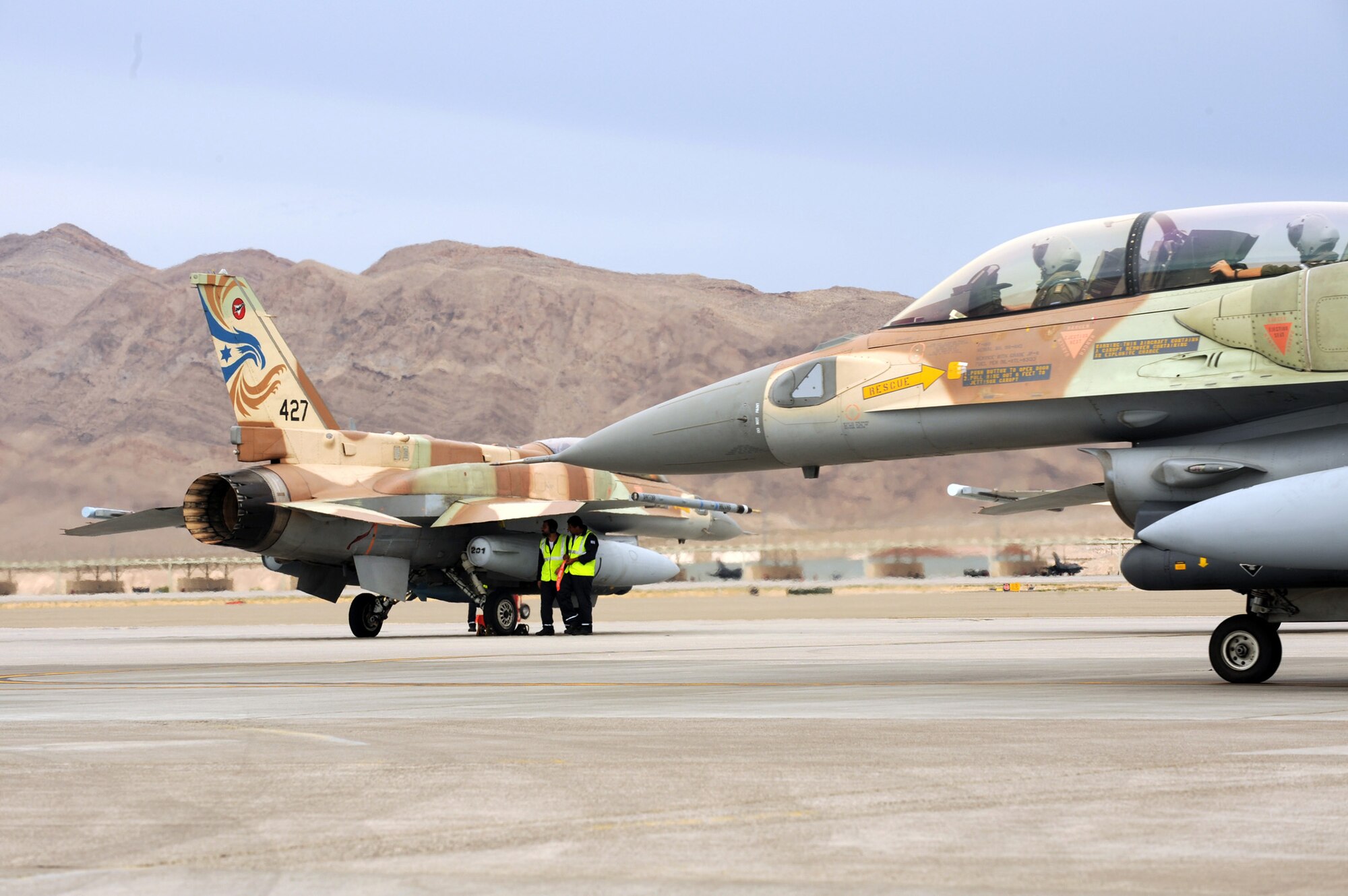 Israeli F-16CGs taxis toward the end of the runway at Nellis Air Force Base, Nev., before departing on a training mission during Red Flag 09-4 on July 20, 2009. Red Flag is a realistic combat training exercise involving the air forces of the United States and its allies. (U.S. Air Force photo/ Tech. Sgt. Michael R Holzworth) 