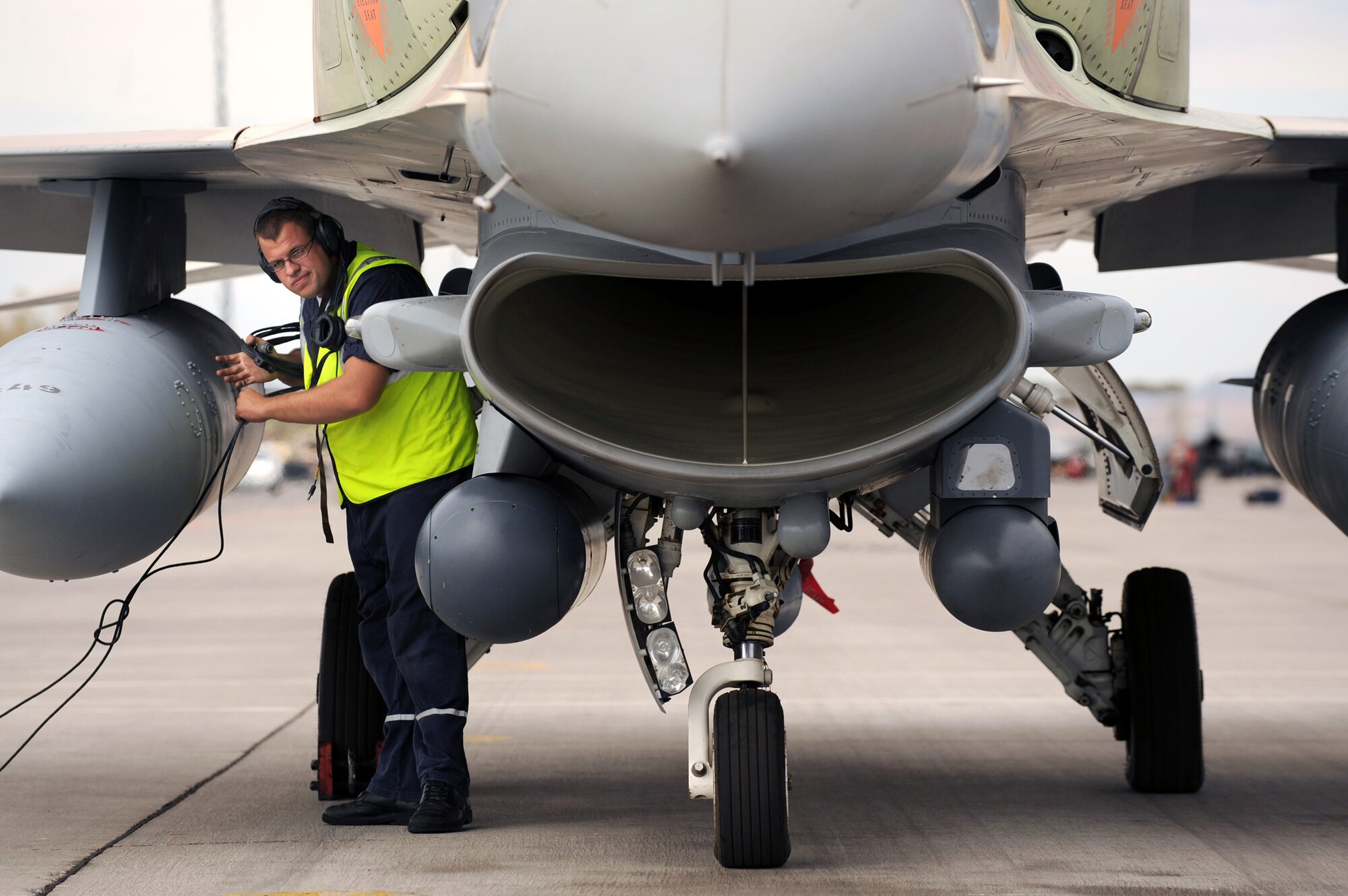 Alexsi, an Israeli Air Force, Crew Chief conducts pre-flight checks at Nellis Air Force Base before a training mission at Red Flag 09-4. Red Flag is a realistic combat training exercise involving the air forces of the United States and its allies. (U.S. Air Force photo/ Tech. Sgt. Michael R Holzworth) 