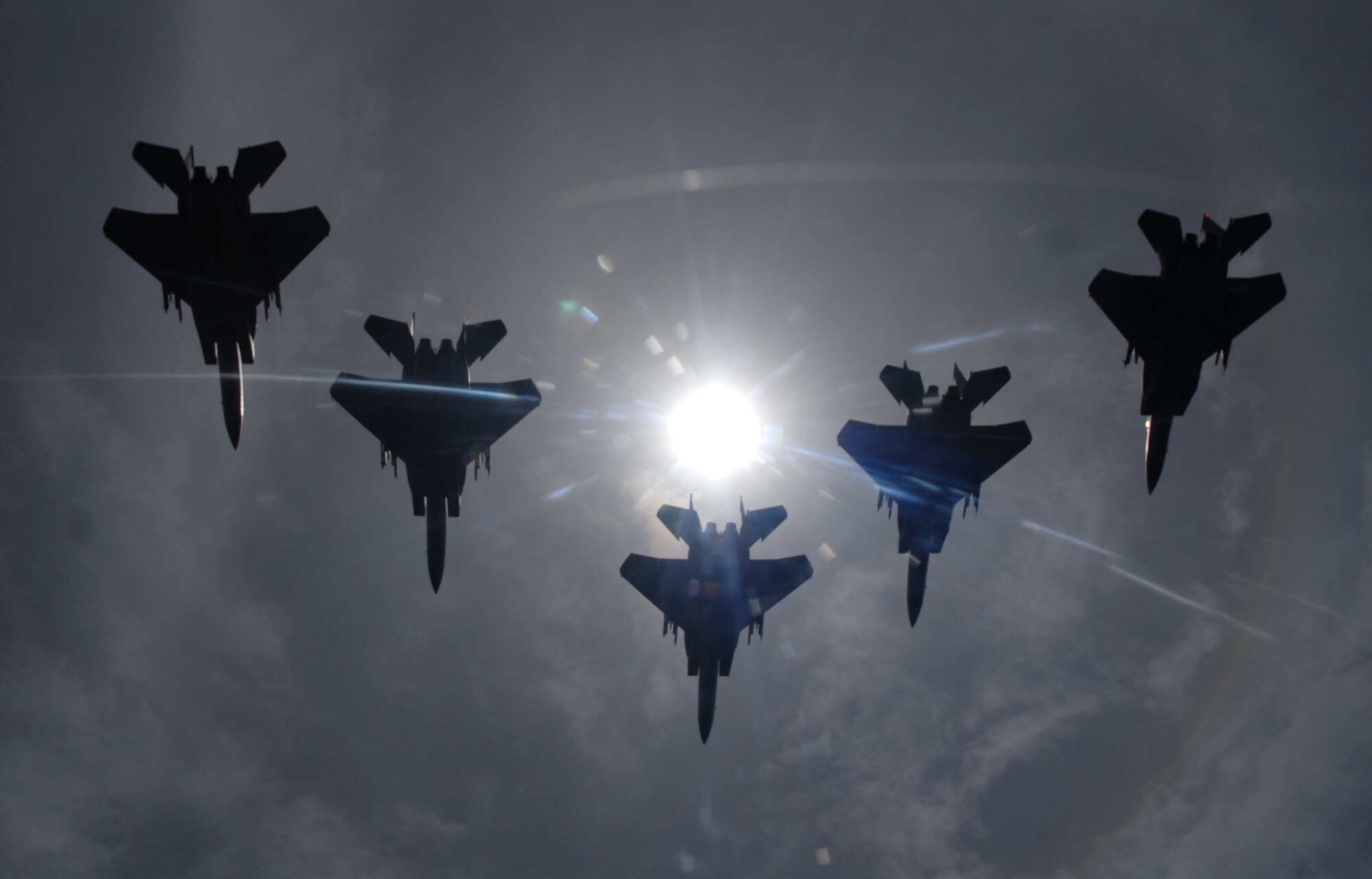 A flight of F-15C Eagles from the 44th Fighter Squadron, Kadena Air Base, flies during a total solar eclipse over the island of Okinawa, Japan July 22, 2009. The eclipse was a rare opportunity for service members stationed here to witness this unique event. (U.S. Air Force photo/Airman 1st Class Chad Warren)