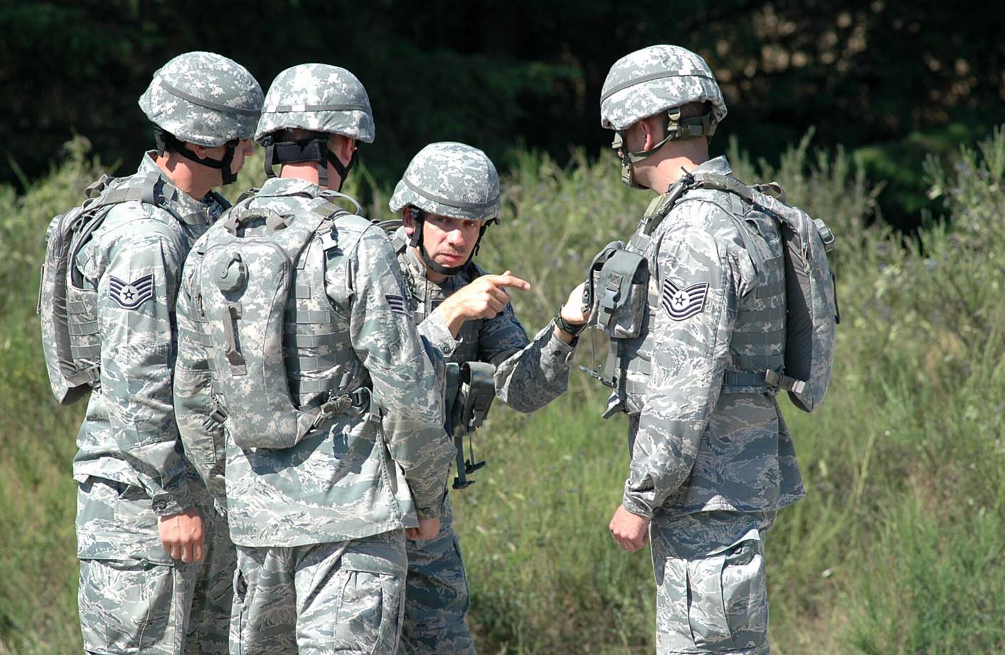 Chief Master Sgt. Ed Stewart reviews the game plan for the 446th Rodeo Security Forces team from McChord Air Force Base, Wash., prior to starting the Combat Tactics event at Fort Lewis, Wash., July 21.  The 446th Airlift Wing, part of the Air Force Reserve, is competing in Air Mobility Command's Rodeo July 19-24. (U.S. Air Force photo/Tech. Sgt. Jake Chappelle)