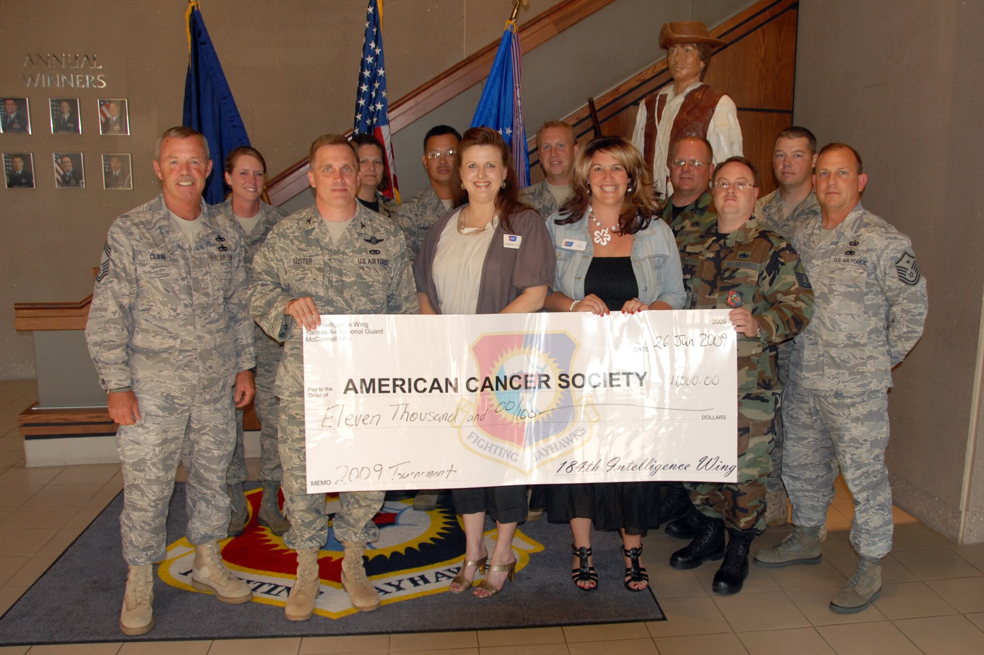 On June 11, Colonel Mike Foster, Commander of the 184th Intelligence Wing,
Kansas Air National Guard, presented a $11,000 check to Elisabeth Cord of
the American Cancer Society.
The money was raised at the Wing's Annual Cancer Golf Tournament held this
year at Hidden Lakes Golf Course.  The 184 IW and the Lyle Houghton Cancer
Golf Committee have raised in excess of $190,000 over the last 23 years.
