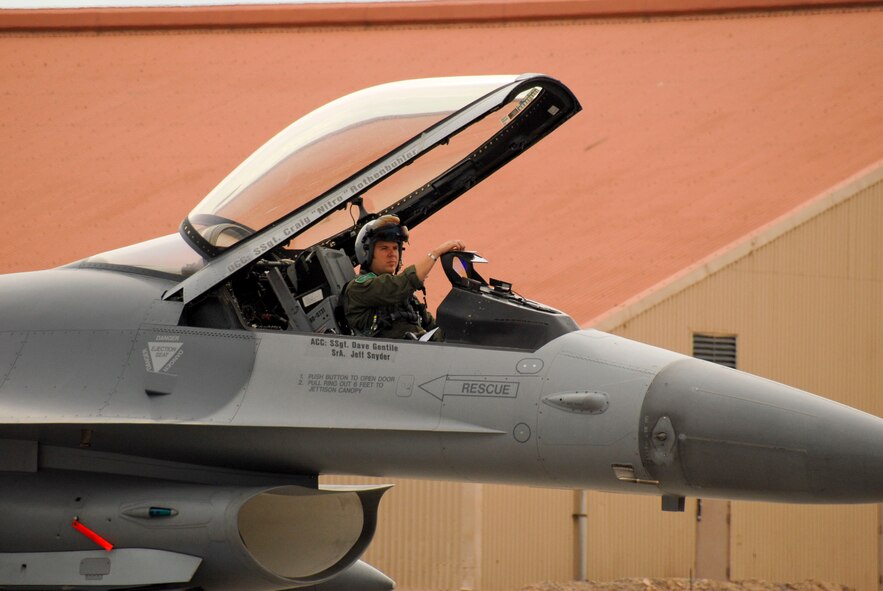 F-16 CM pilot, Capt. Luke "Chops" Jones, from the 180th Fighter Wing, Ohio Air National Guard, prepares for a combat training mission during a Red Flag exercise. Members of the 180th Fighter Wing, Ohio Air National Guard, are currently deployed to Nellis AFB to participate in a Red Flag exercise. Red Flag exercises are intended to provide the most realistic training environments for the United States and allied air forces. ANG photo by Tech. Sgt. Beth Holliker (Released).