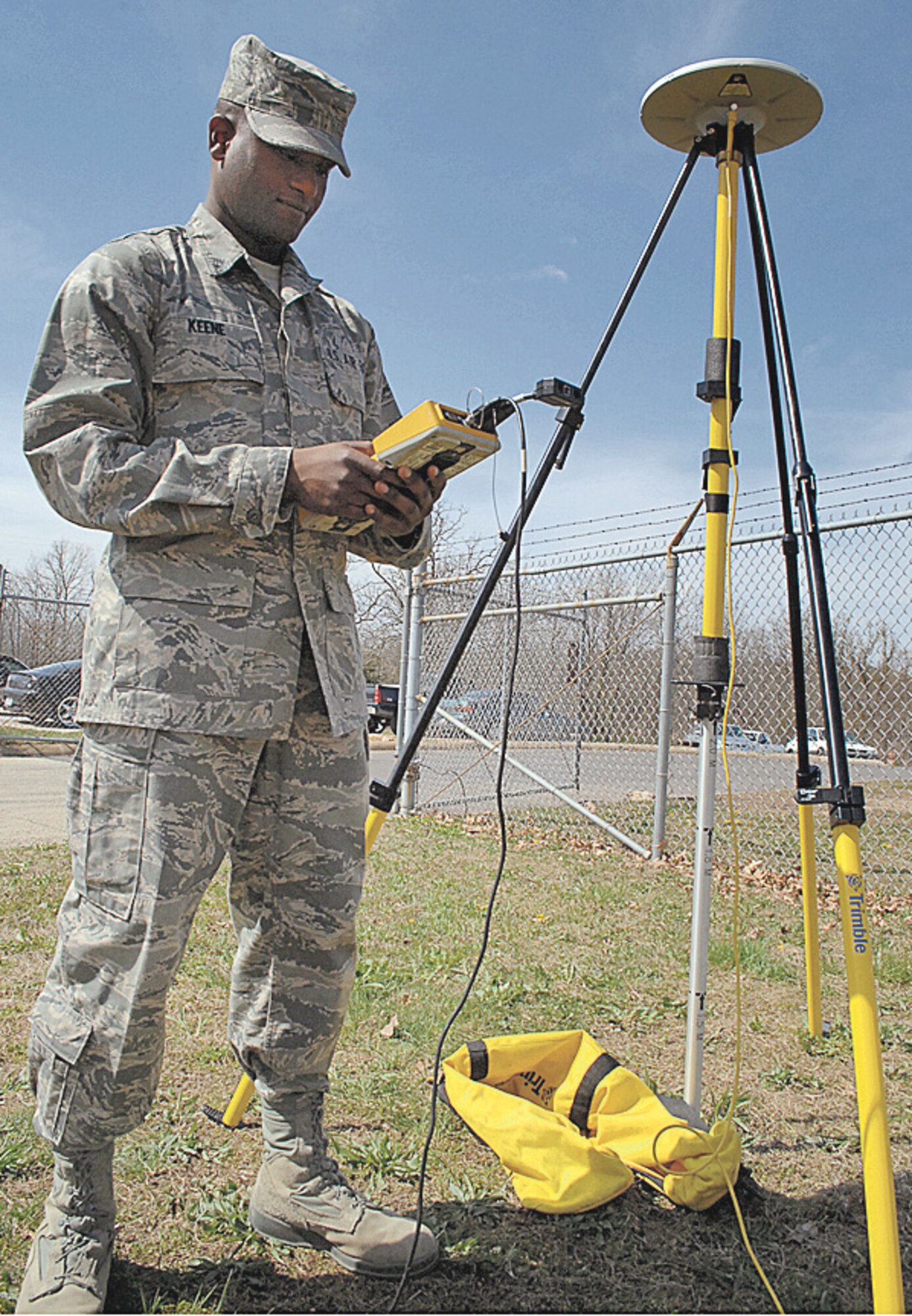 Airman Christopher Keene, Air Force Engineer Assistant Class 007, sets up surveying equipment outside of Brown Hall, April 16. Airmen in the EA apprentice course at Fort Leonard Wood, Mo. spend more than three months working in an inter-service environment learning the basics of sketching, surveying and AutoCAD, an automated drafting program. 
