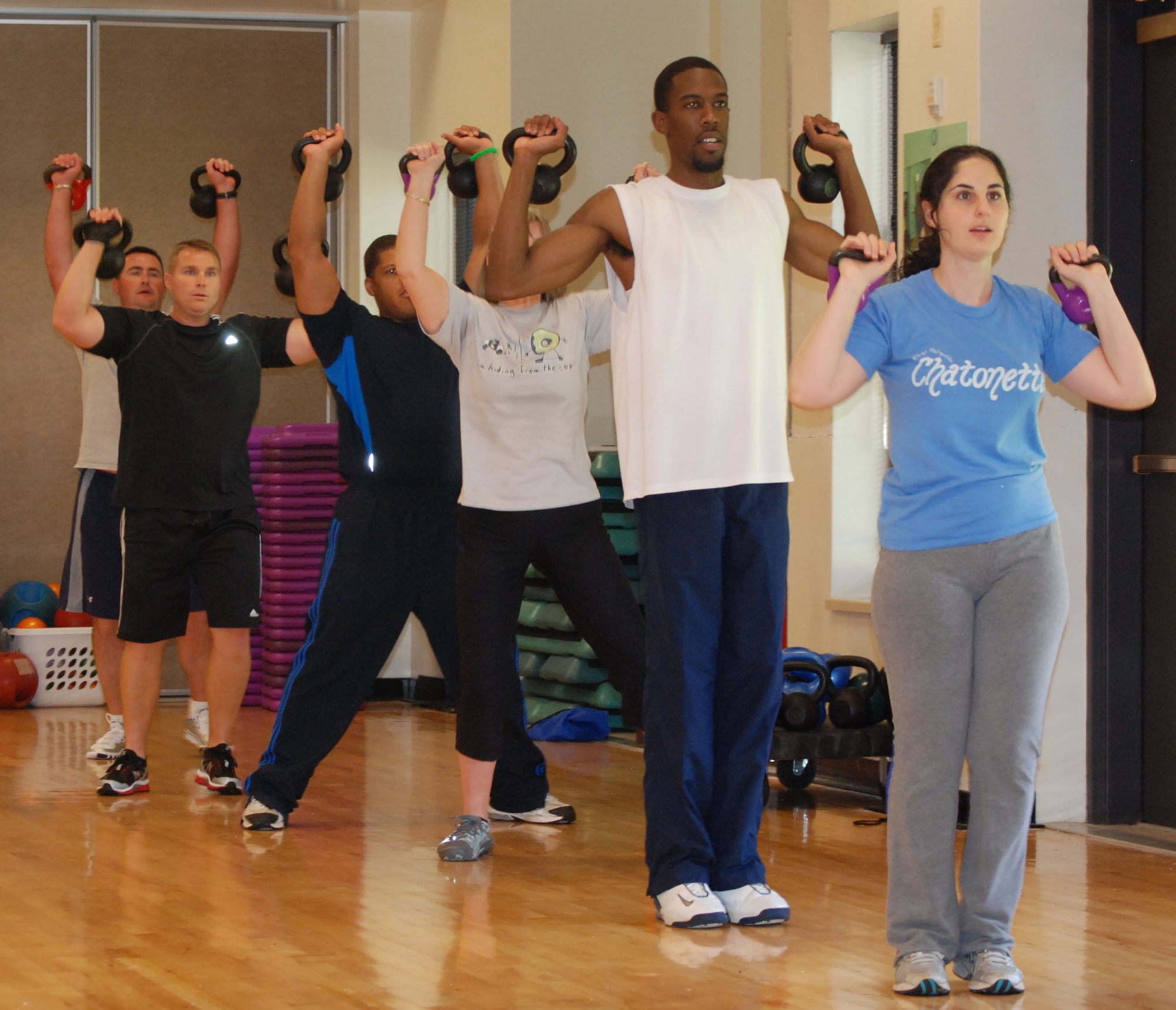 Participants work through one of several exercises in the Kettelbell workout program July 21 at the Pitsenbarger gym. The class contains non-stop action giving the body a cardiovascular and muscular workout. The class is taught every Tuesday and Thursday. (U.S. Air Force Photo/ Airman 1st Class Matthew Varga)   