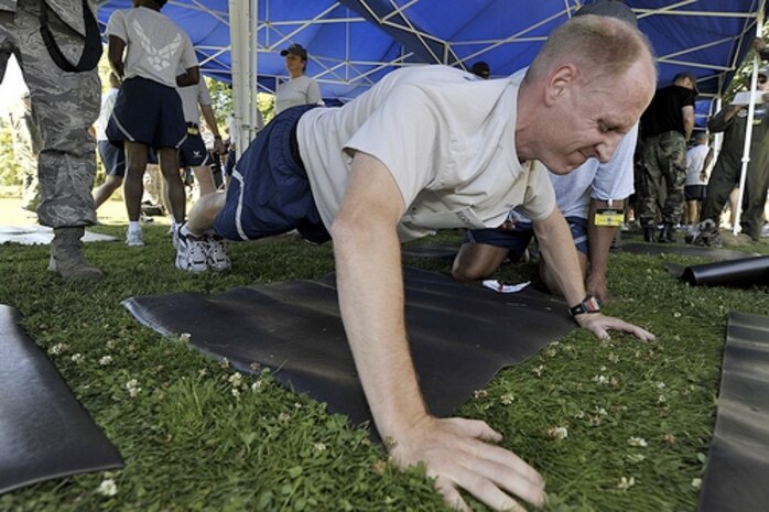 Maj. Jesse Baker performs pushups during the "Fit-to-Fight" competition at Air Mobility Rodeo 2009 at McChord AFB, Wash., July 19. Rodeo is an international combat skills and flying operations competition designed to develop and improve techniques and procedures with international partners to enhance mobility operations. Major Baker is the director of staff for the 17th Airlift Squadron. (U.S. Air Force photo/James M. Bowman)