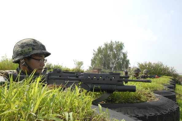 Three Republic of Korea Forces personnel man a patrol station and keep a look out on the flight line during exercise Beverly Bulldog 09-03 at Osan Air Base, Republic of Korea, July 22. (U.S. Air Force photo/Senior Airman Stephenie Wade)