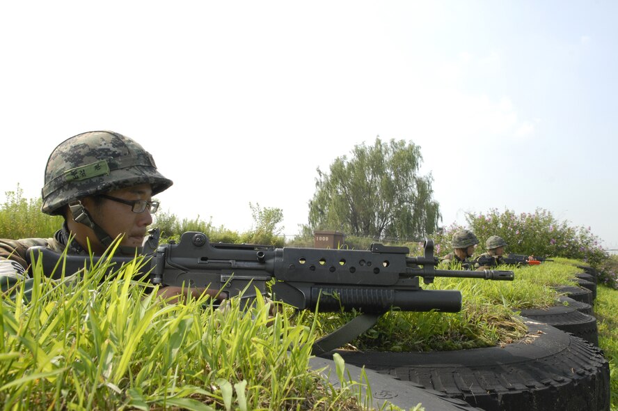 Three Republic of Korea Forces personnel man a patrol station and keep a look out on the flight line during exercise Beverly Bulldog 09-03 at Osan Air Base, Republic of Korea, July 22. (U.S. Air Force photo/Senior Airman Stephenie Wade)