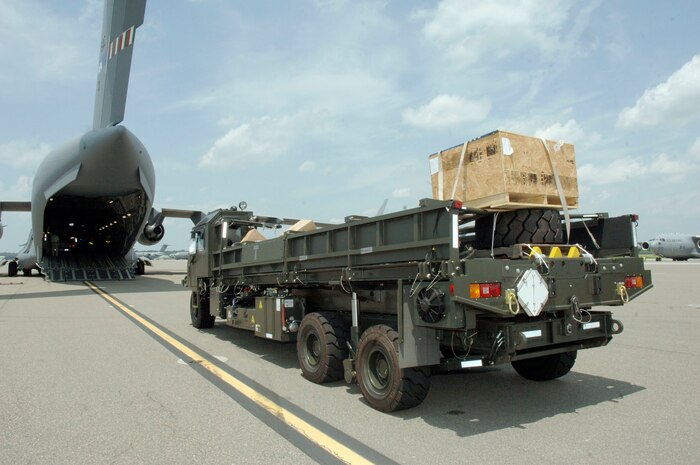 A next generation small loader straight from the assembly line is loaded onto a C-17 bound for Papa AB, Hungary July 17. Papa AB is an old Soviet air force fighter base that is currently being used as a NATO base. (U.S. Air Force photo/Staff Sgt. Marie Cassetty)(RELEASED)