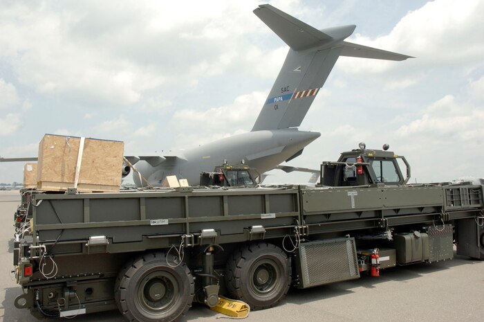 Two next generation small loaders straight from the assembly line sit on the Charleston AFB flightline prior to being loaded onto a C-17 bound for Papa AB, Hungary July 17. Papa AB is an old Soviet air force fighter base that is emerging as a NATO base. (U.S. Air Force photo/Staff Sgt. Marie Cassetty)(RELEASED)