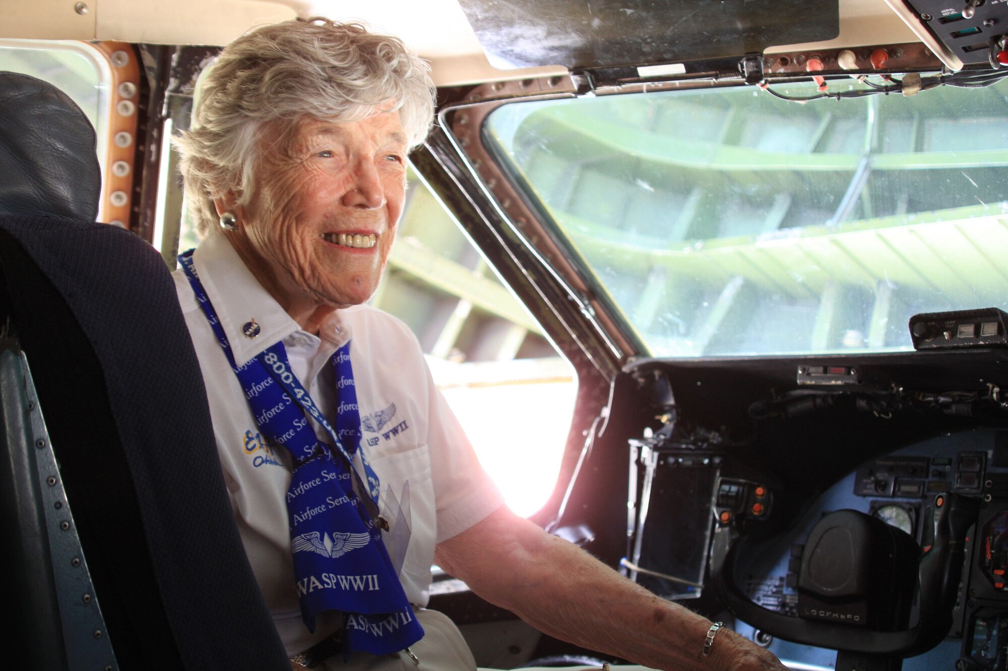 WRIGHT-PATTERSON AIR FORCE BASE, Ohio - Dawn Seymour, World War II Women Airforce Service Pilots (WASP), tours the flight deck of a 445th Airlift Wing C-5 Galaxy aircraft.  Four WASPs were special guests of the July 17 Third Annual Wings of Women Conference attended by 46 young women in grades 9-12.  Part of the day-long event included a stop at the 445th Airlift Wing for a wing mission briefing, 445th Aeromedical Evacuation Squadron presentation and C-5 tour.  (Air Force photo/Senior Airman Mikhail Berlin)