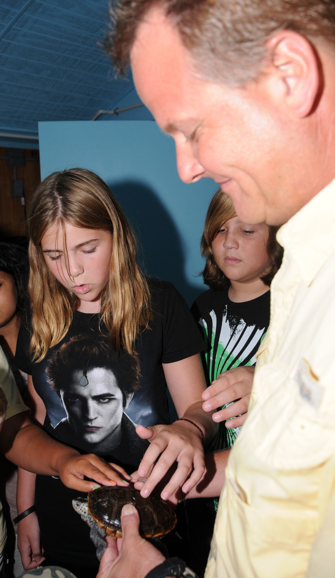 Eleven-year-olds Rowan McConville, left, and  Tyler Higgins learn about the Mississippi diamondback terrapin turtle from Sea Camp director Michael Carley.  Rowan’s parents are Lt. Col. Abbie Luck, 81st Medical Operations Squadron, and Marine Corps retiree Stephen Dubois.  Her mother is deployed to Iraq.  Tyler’s parents are Frank and Patricia Higgins of Gautier.  (U.S. Air Force photo by Kemberly Groue)