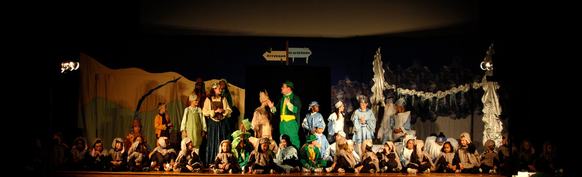 MCCONNELL AIR FORCE BASE, Kan. -- The entire cast of “The Princess and the Pea” sits on stage at the base theater as they perform their last song, July 18. The children assisted in stage set-up, make-up and costums, and learned a play with multiple songs in less than a week. (Photo by Senior Airman Laura Suttles)