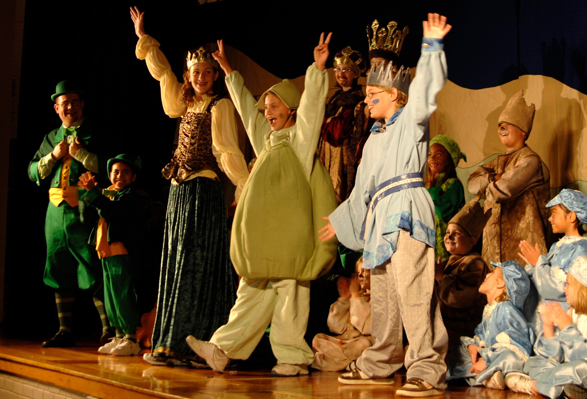 MCCONNELL AIR FORCE BASE, Kan. -- The cast of “The Princess and the Pea” perform at the base theater, July 18. The pea, played by Rebecca Harrington, entertains the audience as a talking pea that is constantly with the riverdom princess’s side, singing, dancing and helping the princess. (Photo by Senior Airman Laura Suttles)