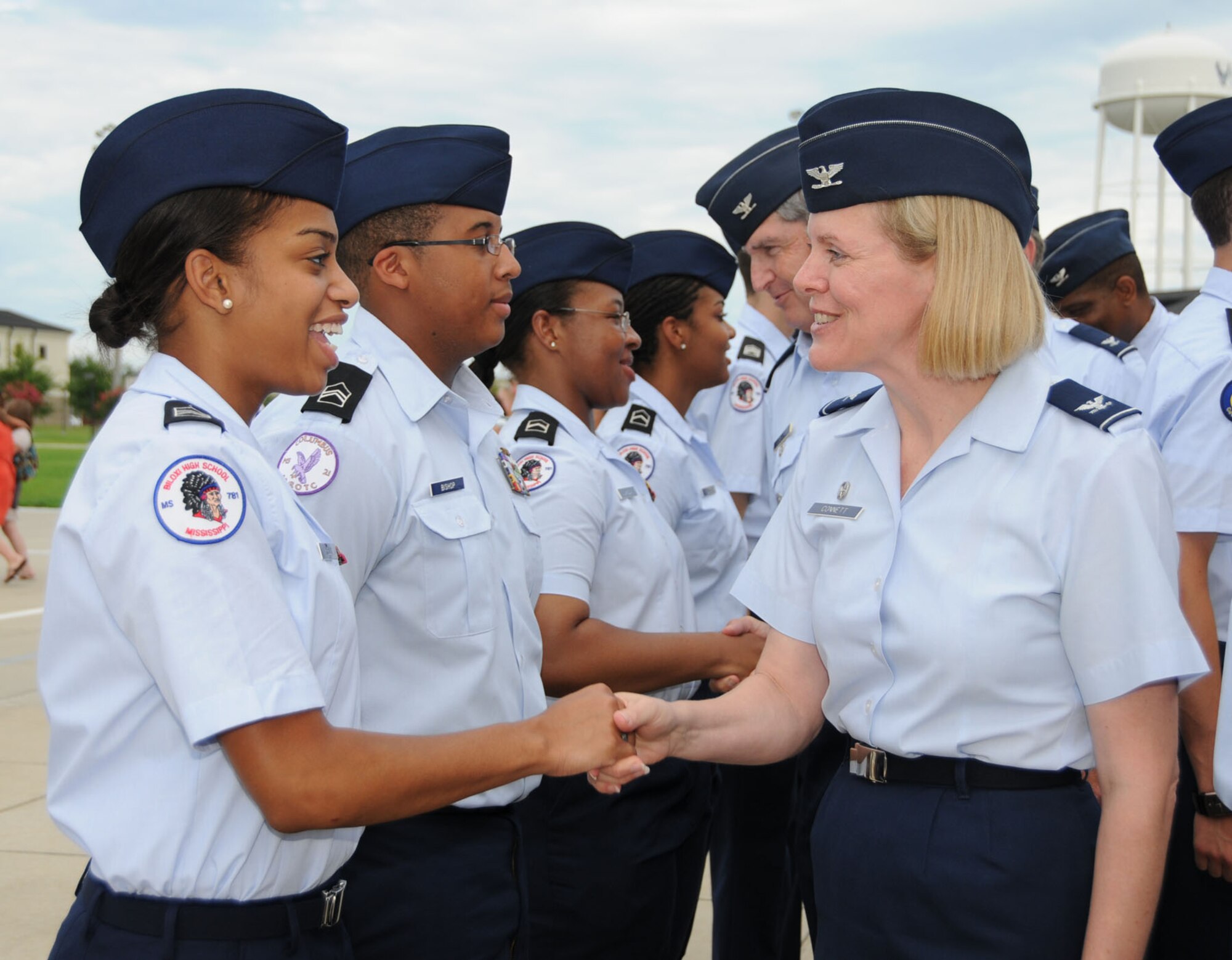 Biloxi High School Cadet Jeanece Kelly, left, meets Col. Lynn Connett, 81st Training Group commander, during Friday’s parade at the conclusion of the Junior ROTC Summer Leadership School at Keesler last week.  Cadet Kelly’s parents are Jimmy and Katrina Kelly.  Her father is the retired former command chief at 2nd Air Force.  The annual school, hosted by Biloxi High’s ROTC program for units from Mississippi and surrounding states, includes physical training, lectures, marching, uniform inspections, team building exercises, speeches and drill evaluations.  Cadets live, eat and study on base during the week.  (U.S. Air Force photo by Kemberly Groue)