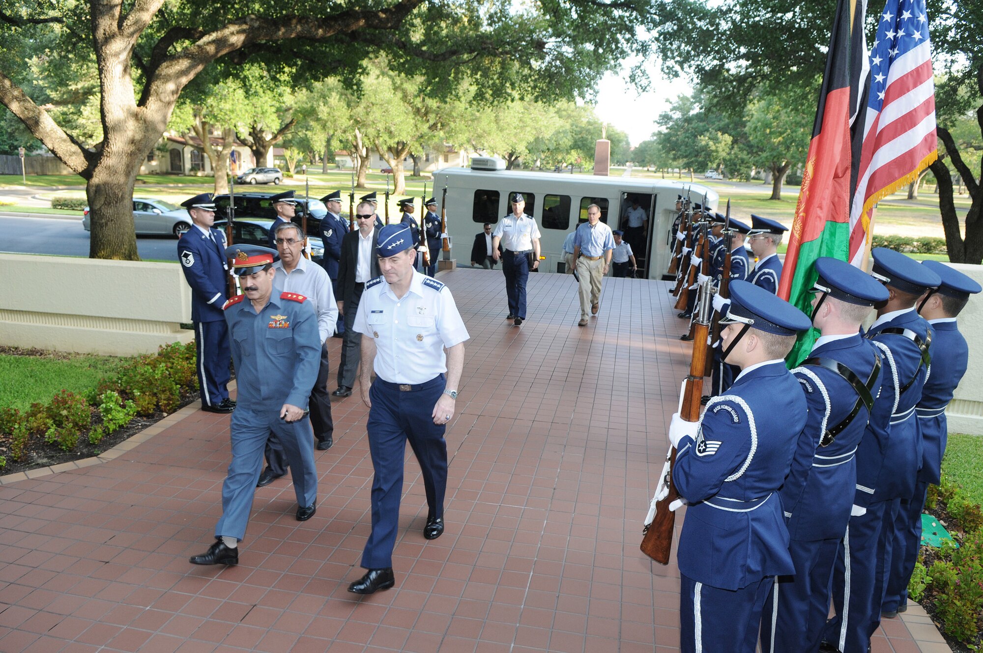 Afghan national air army corps Maj. Gen. Mohammad Dawran and Gen. Stephen R. Lorenz walk to meetings as part of General Dawran's visit to strengthen the training partnerships between the two air forces July 16 at Randolph Air Force Base, Texas. General Dawran is the Afghan national air army corps commander, and General Lorenz is the Air Education and Training Command commander. (U.S. Air Force photo/Richard McFadden) 